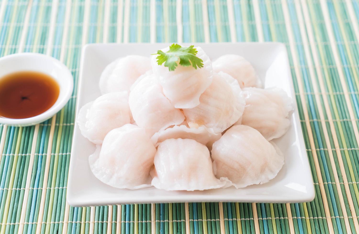 A plate of steamed dim sum dumplings photo