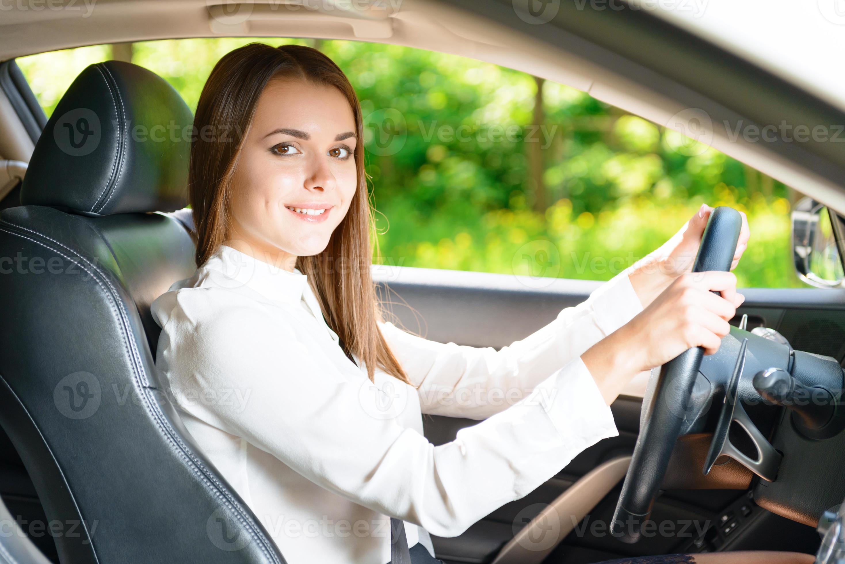 Beautiful woman sitting in car 1260696 Stock Photo at Vecteezy