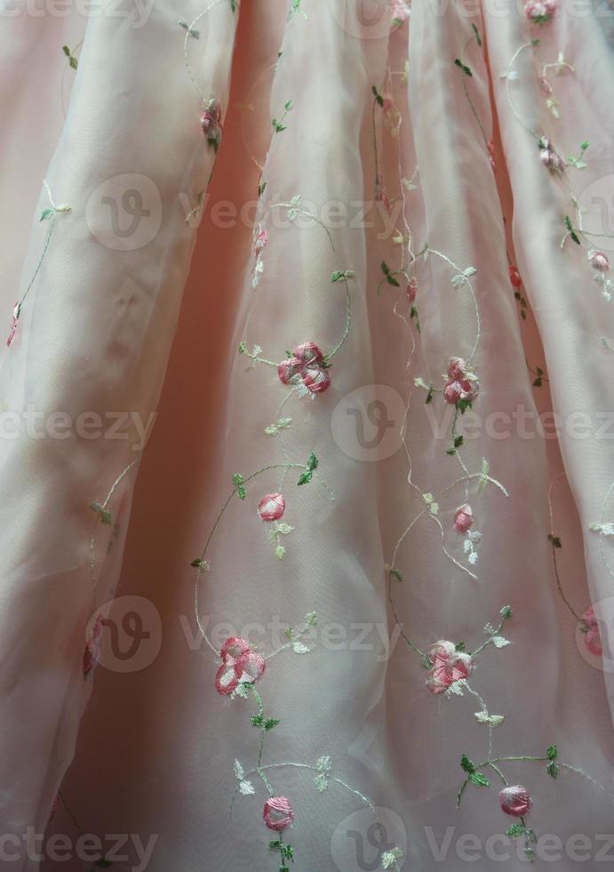 Sheer Pink Dress Detail with Embroidered Flowers photo
