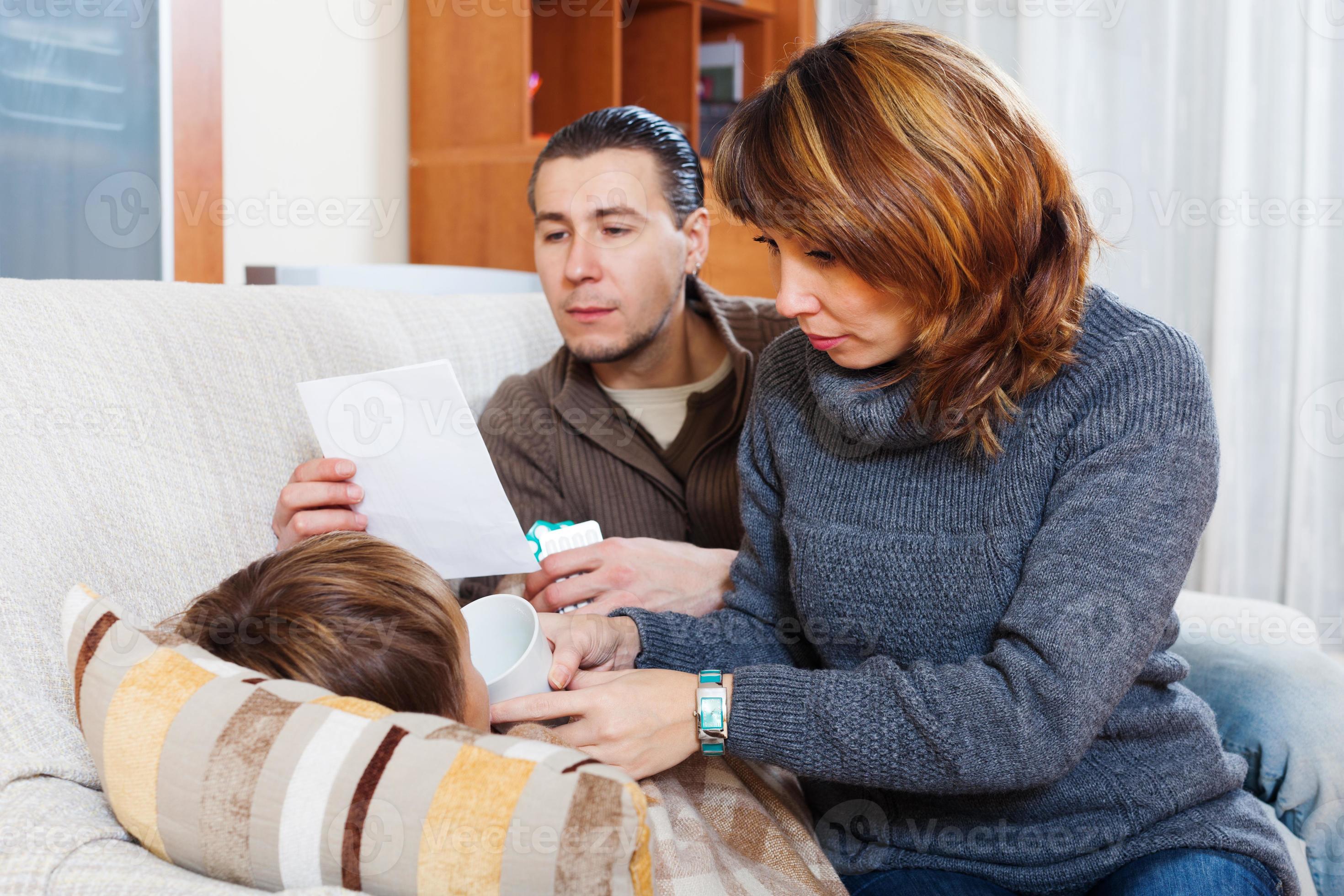 parents caring for sick teenager boy 1261717 Stock Photo at Vecteezy