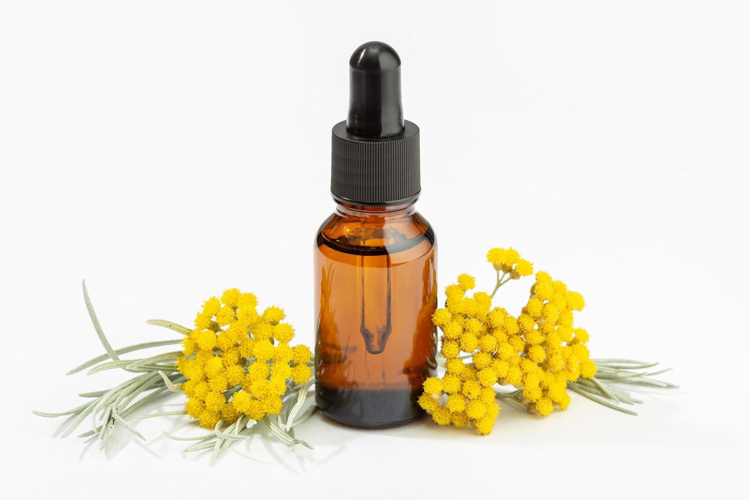 Helichrysum essential oil on amber bottle  photo
