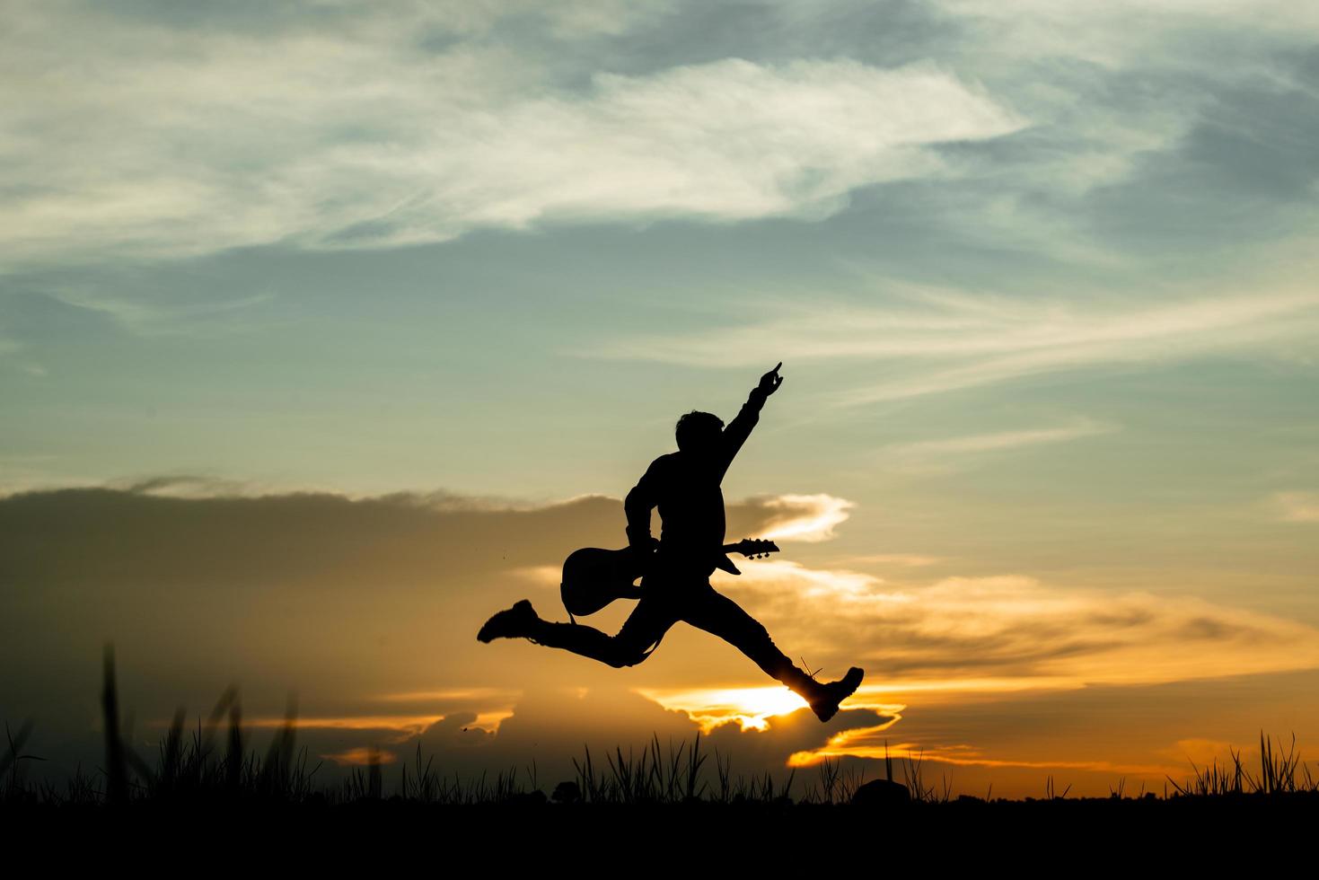 Man with guitar silhouette  photo