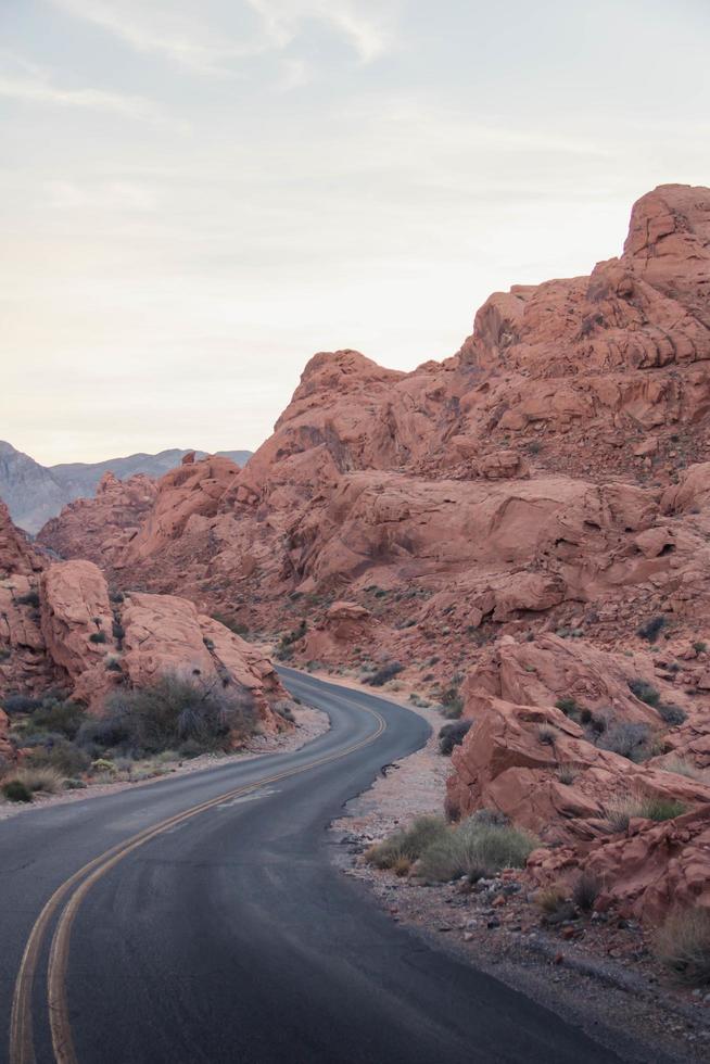 Winding road between rocky hills photo