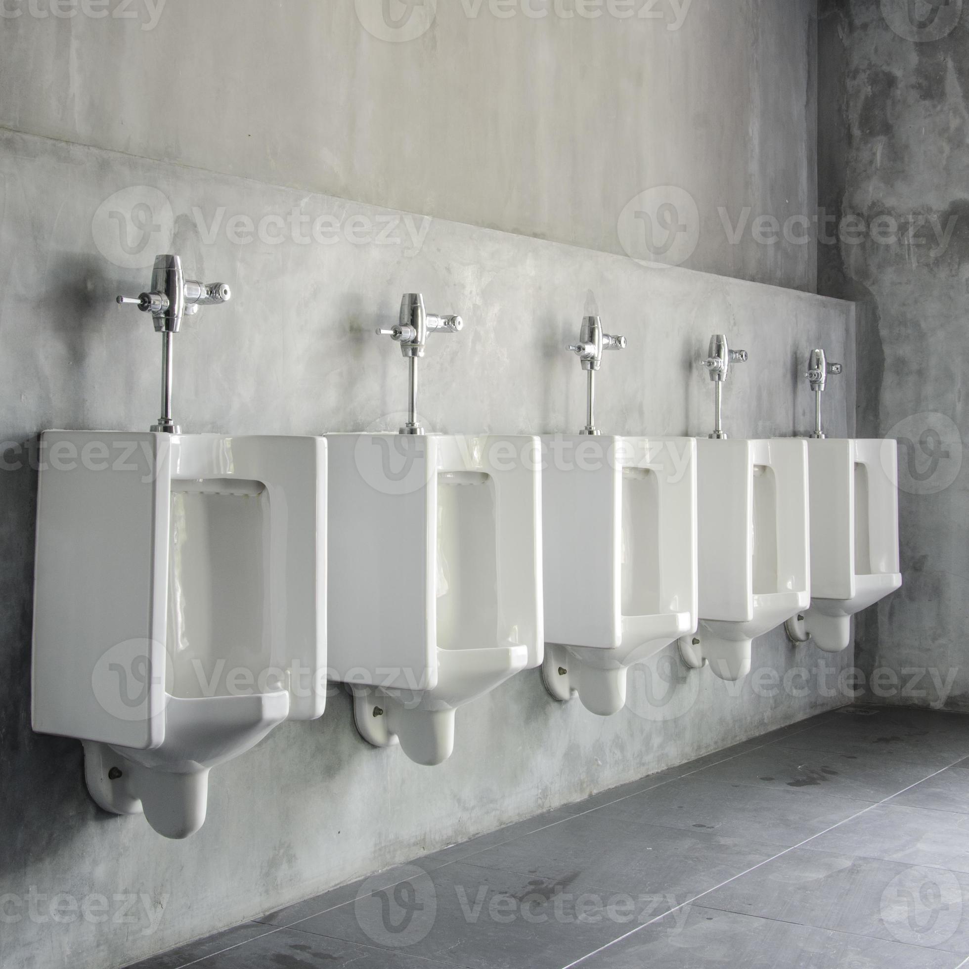Line of white porcelain urinals in public toilets 1265026 Stock Photo
