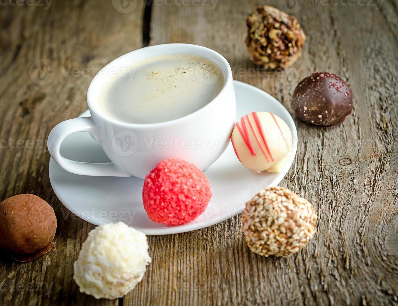Luxury chocolate candies and cup of coffee photo