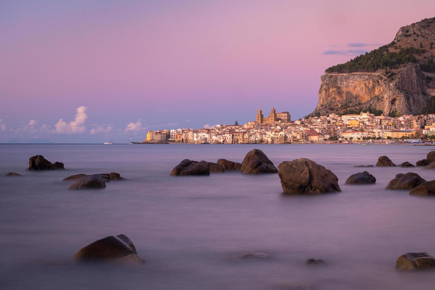 Sunset at Cefalu beach photo