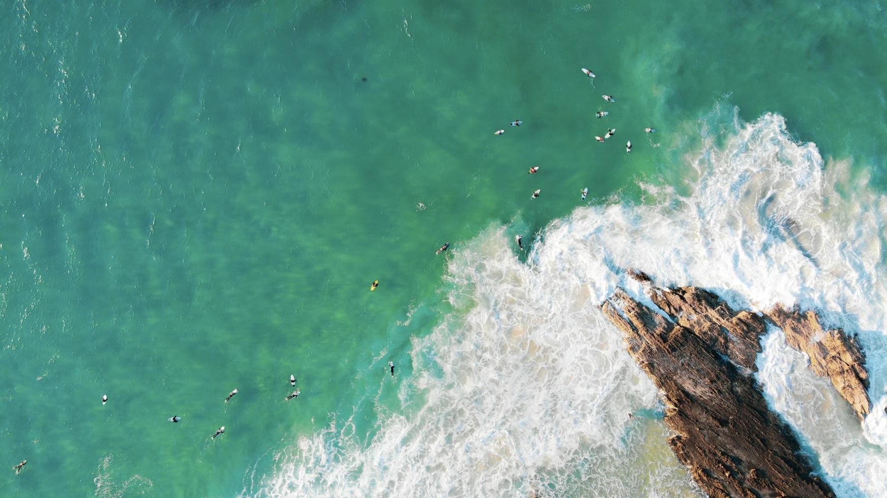 Surfers on the Pacific Ocean photo