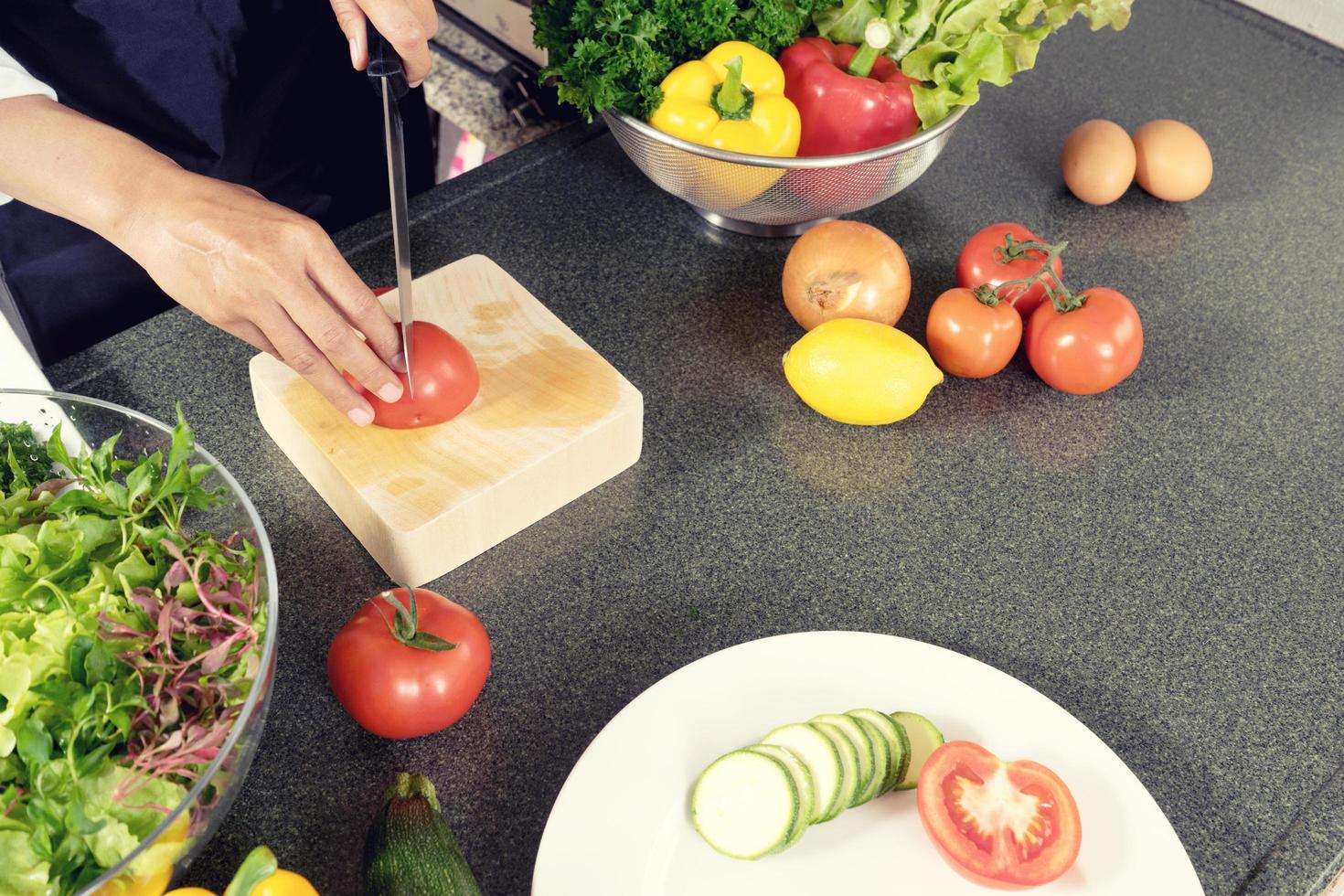 Home cook cutting vegetables photo