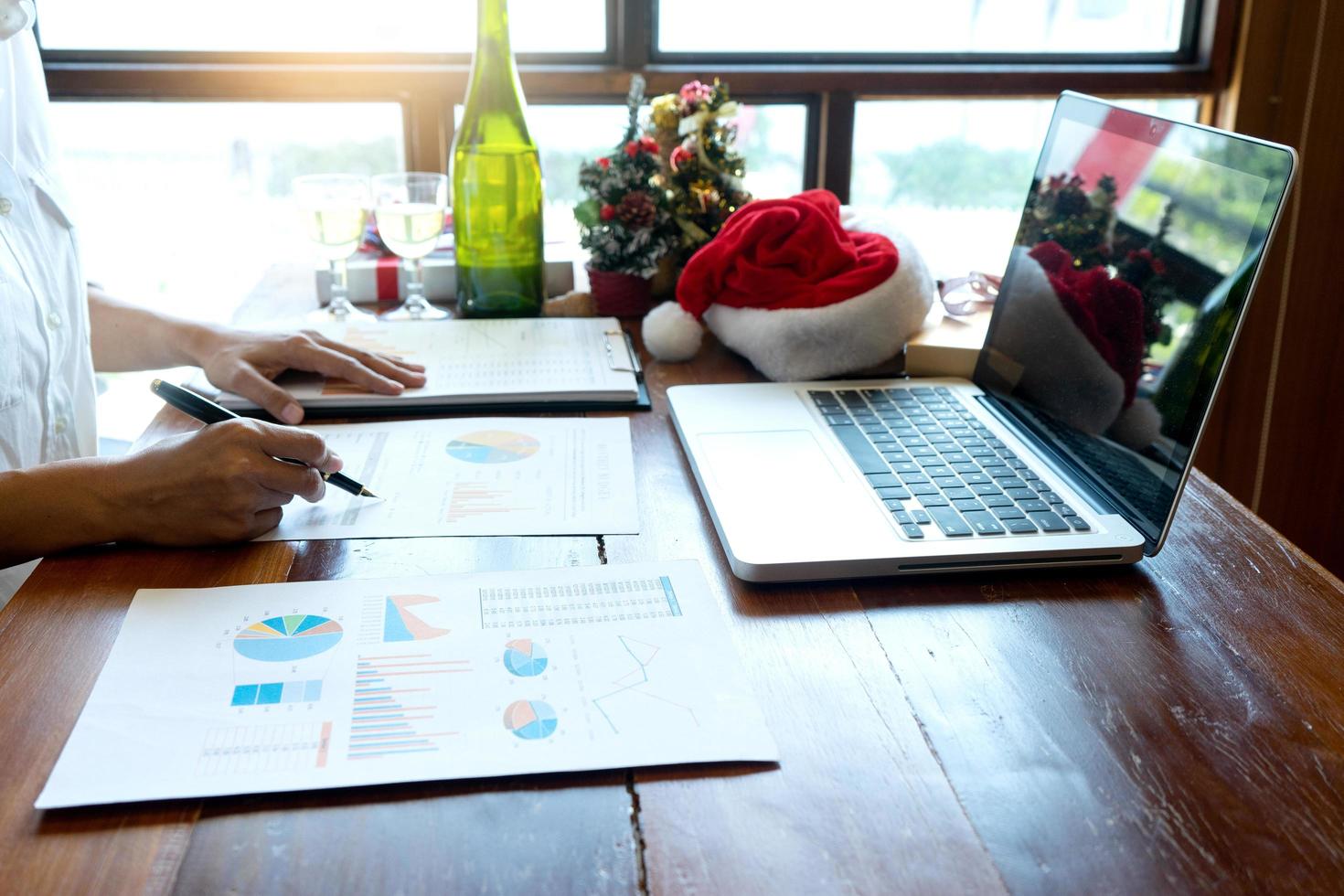 Business professional working on reports at desk photo