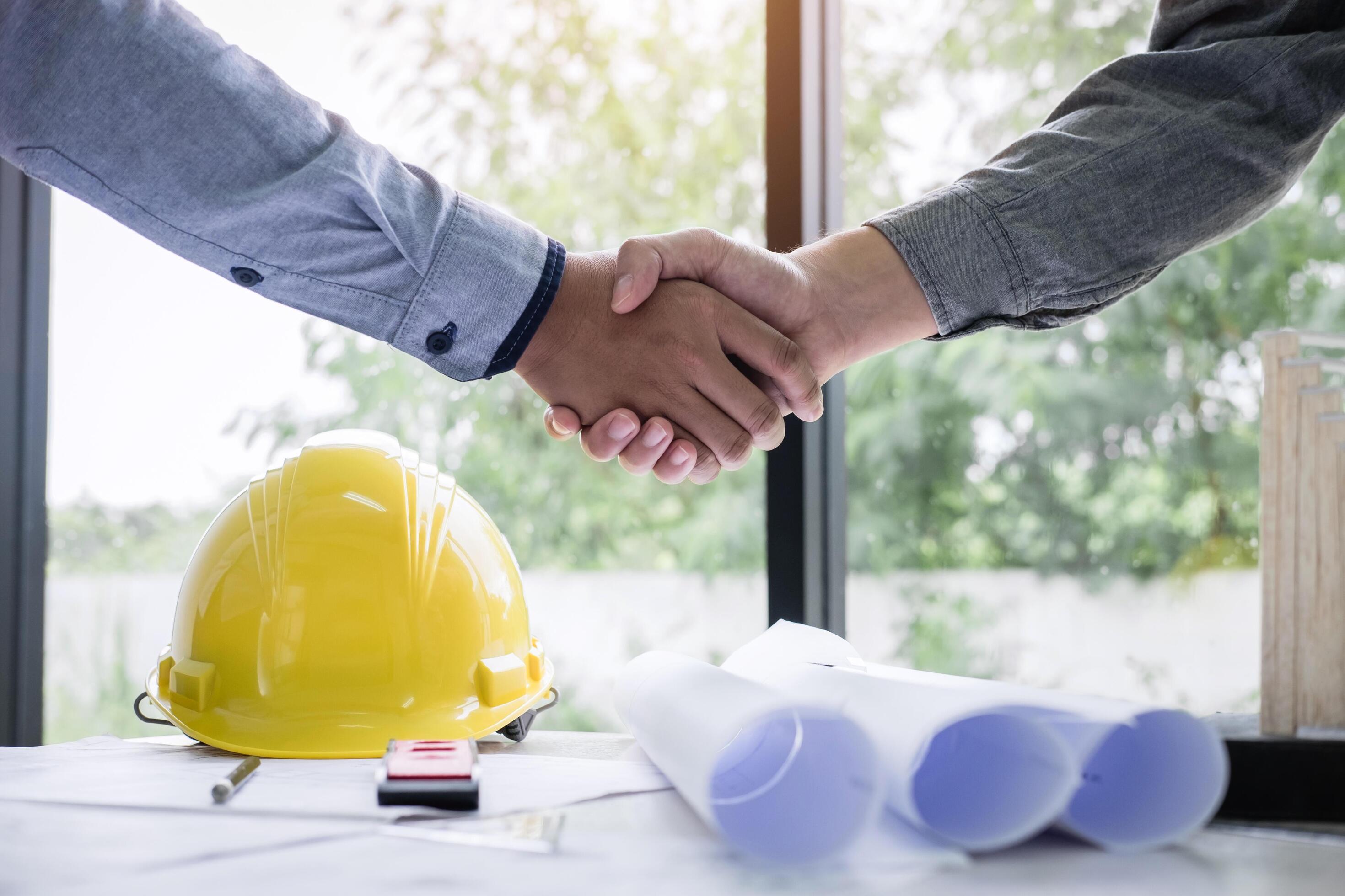 Construction engineers shake hands 1268285 Stock Photo at Vecteezy