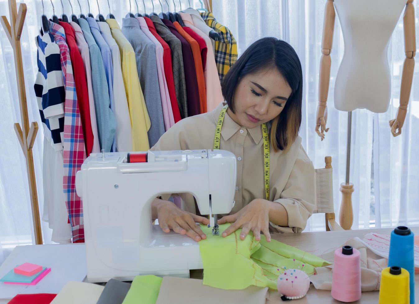 Seamstress sewing fabric photo