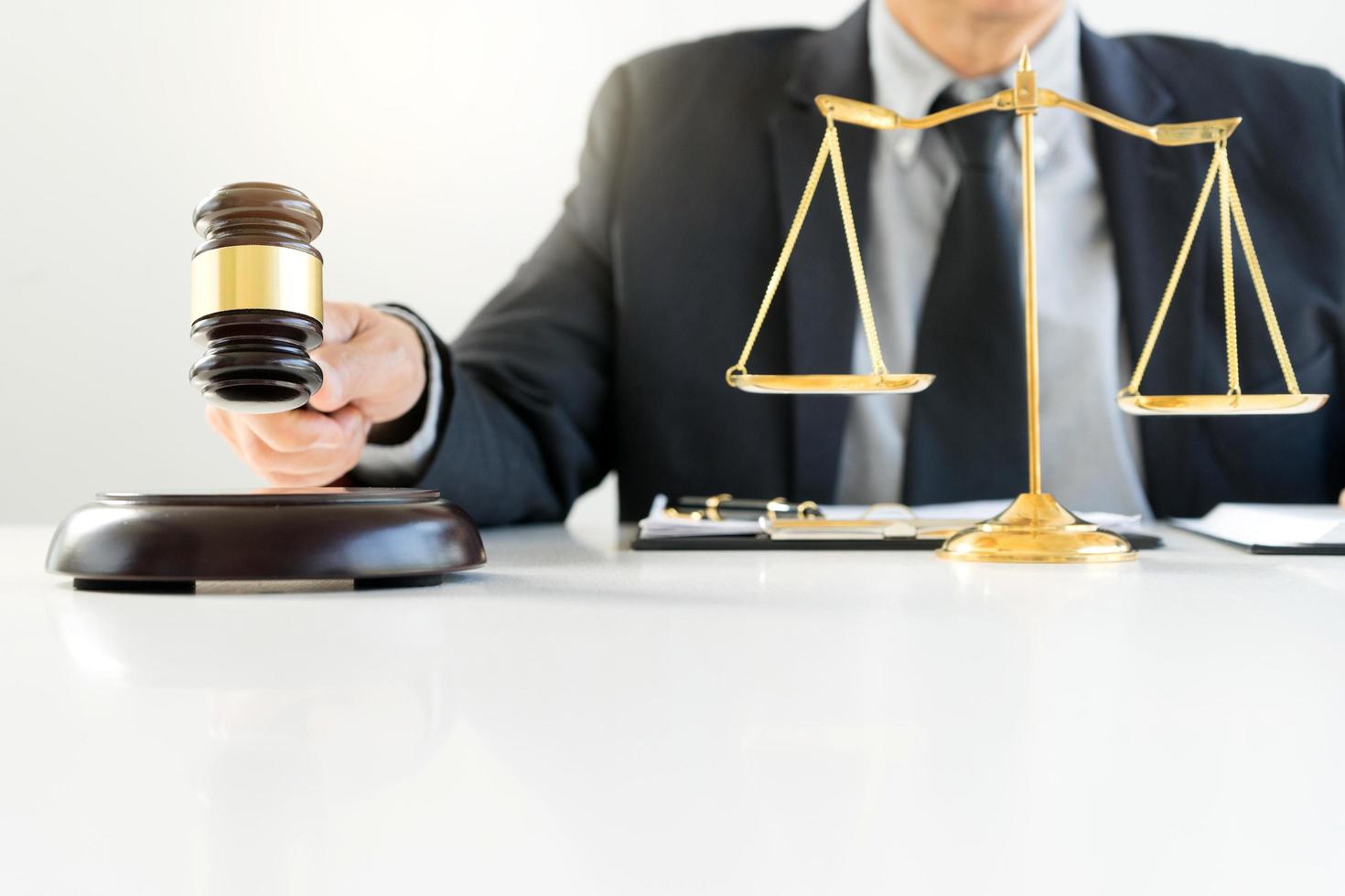 Close-up of judge holding gavel photo