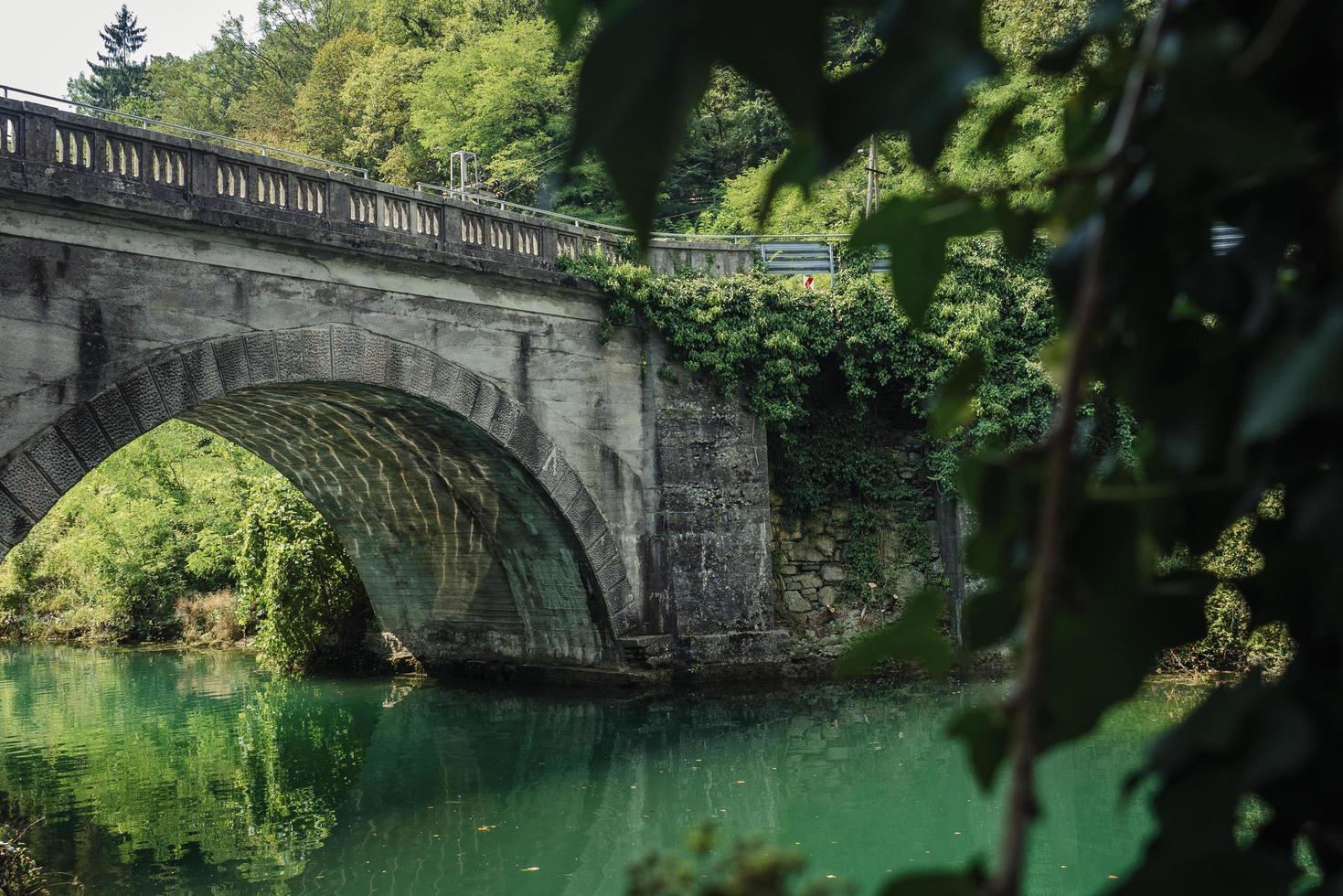 Gray bridge over a river photo