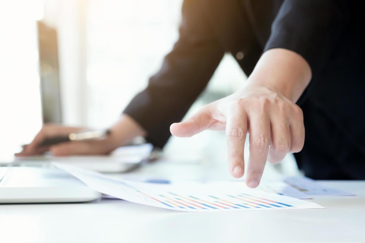Businessman analyzing report photo