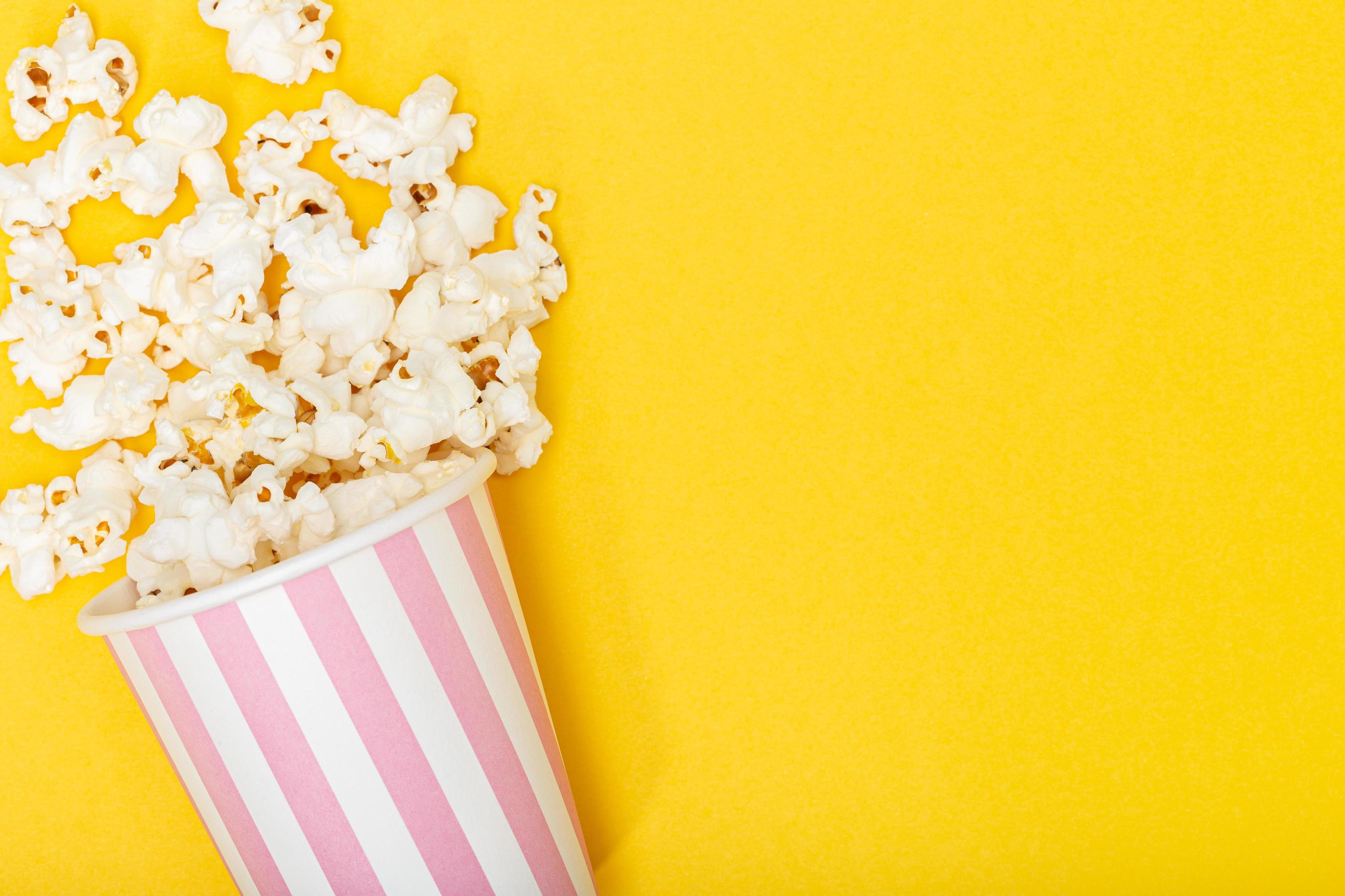 Popcorn bucket on yellow background 1269787 Stock Photo at Vecteezy
