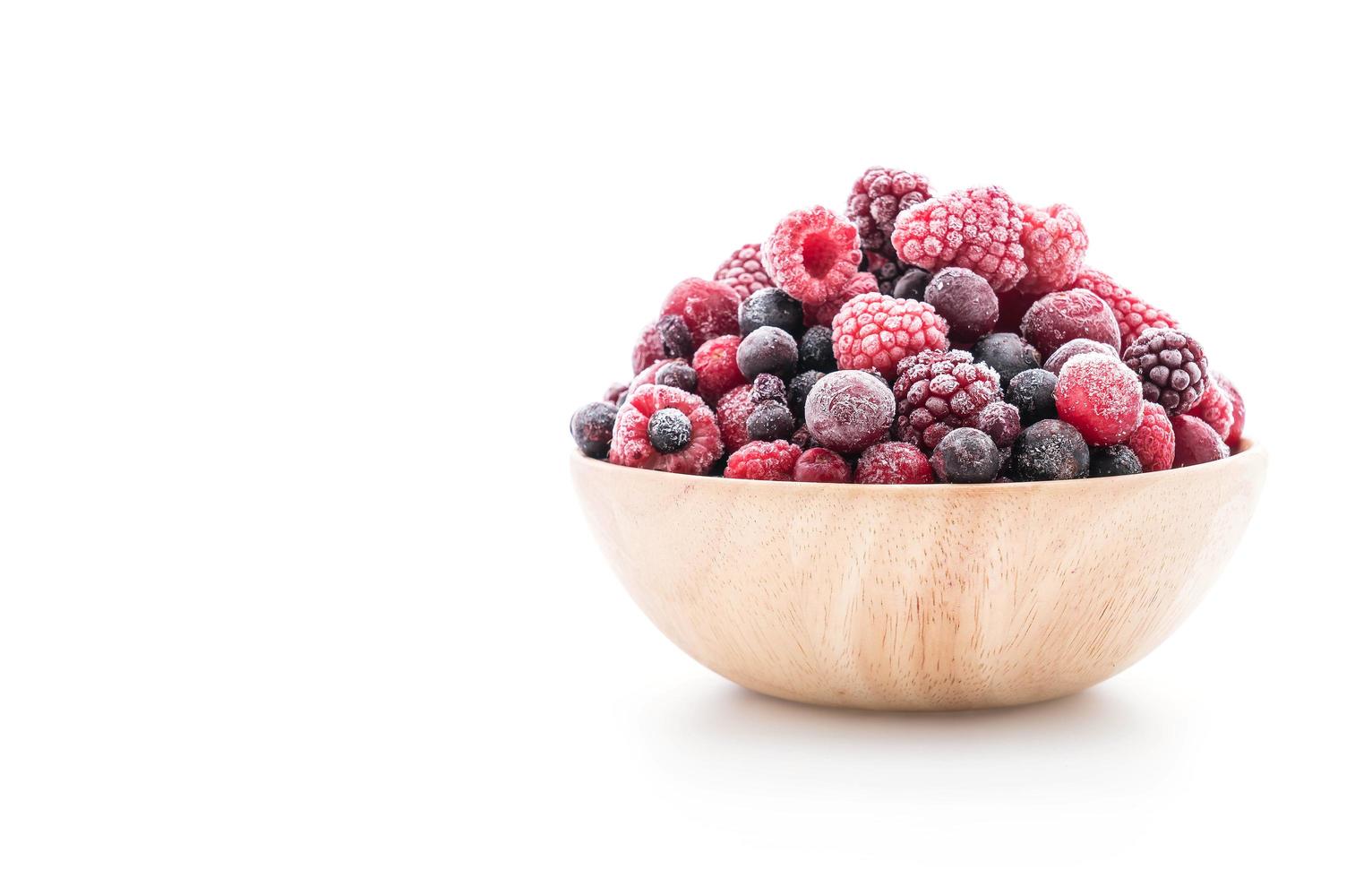 Frozen berries in wooden bowl photo