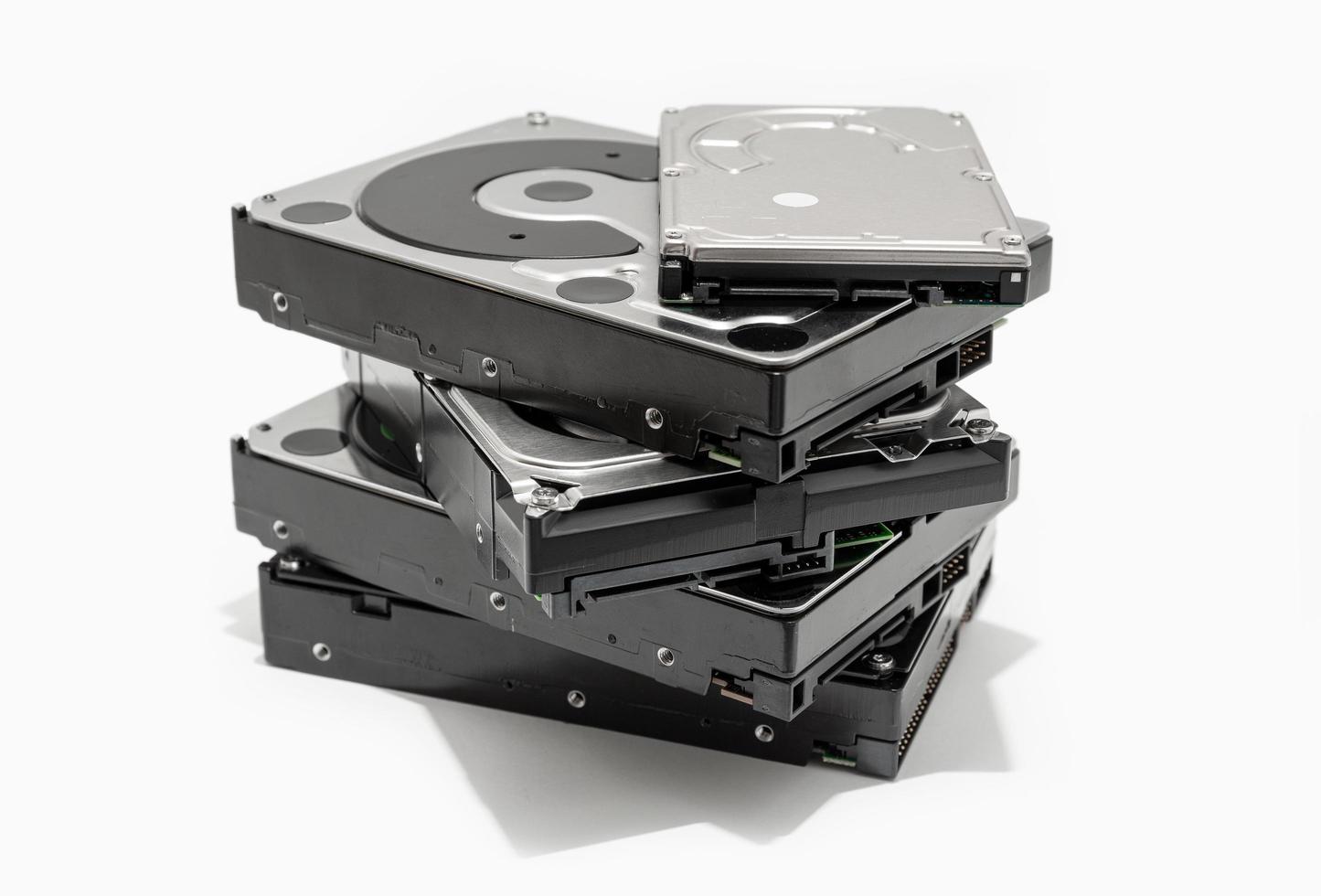 Pile of hard drives on a white background photo