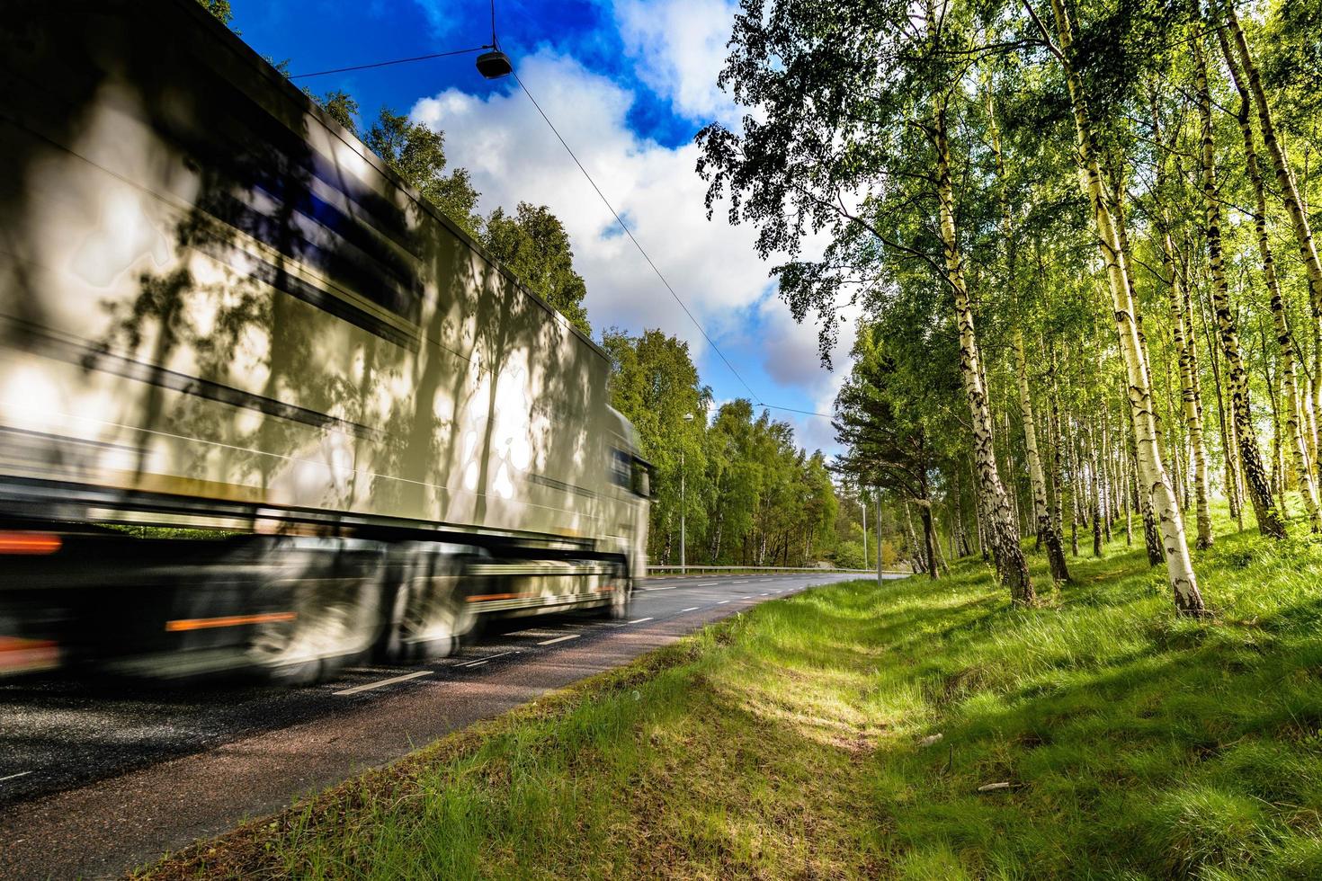 Large truck traveling on the road photo