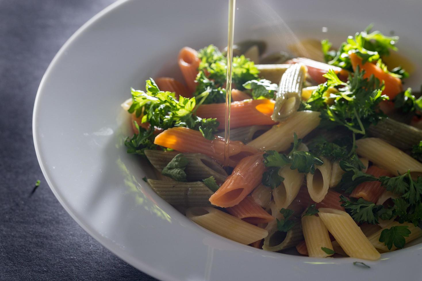 Pesto pasta with olive oil photo