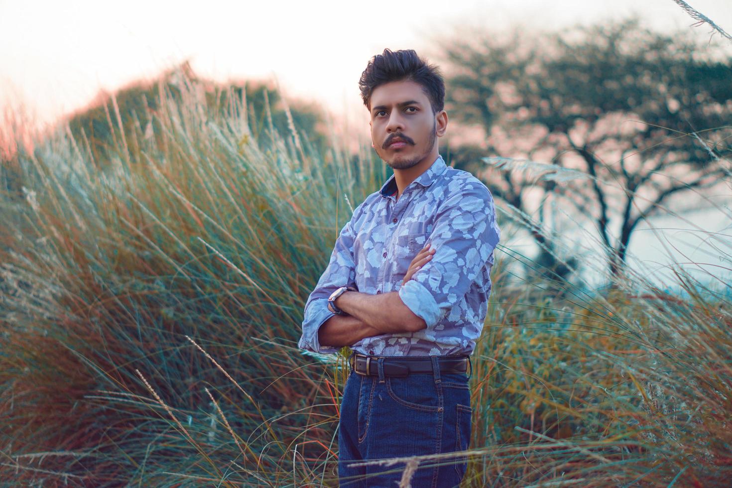 Young man posing in nature photo