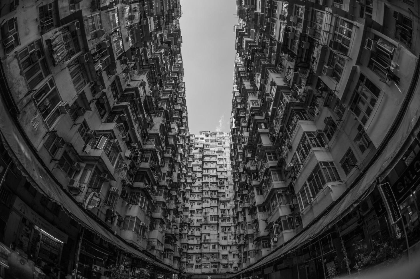 Grayscale fish eye of high rise buildings photo