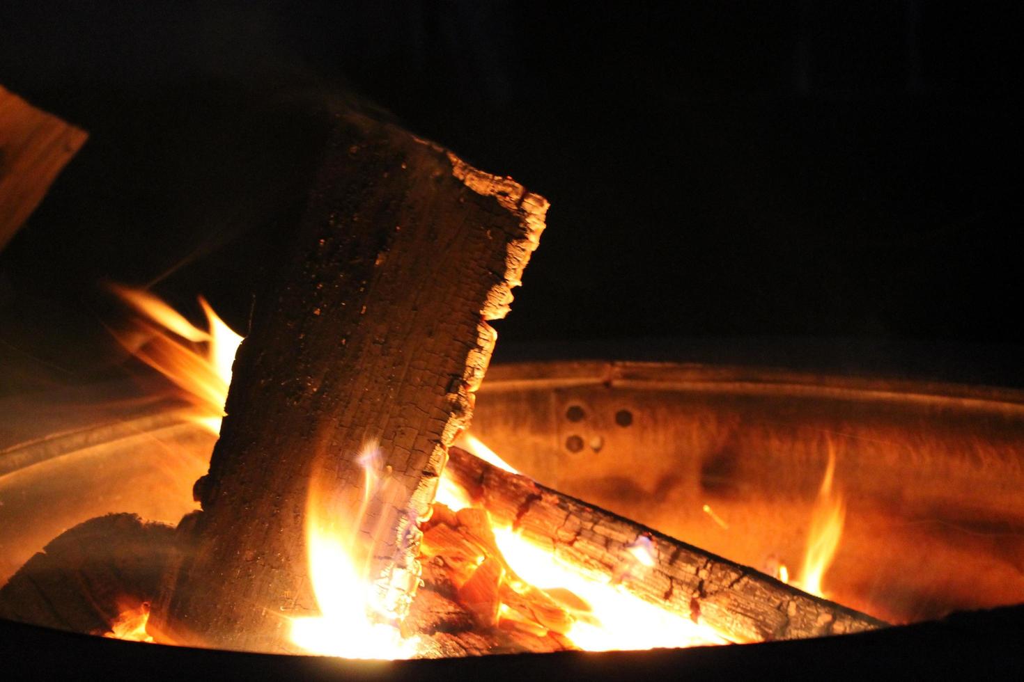 Burning wood in a fire pit photo