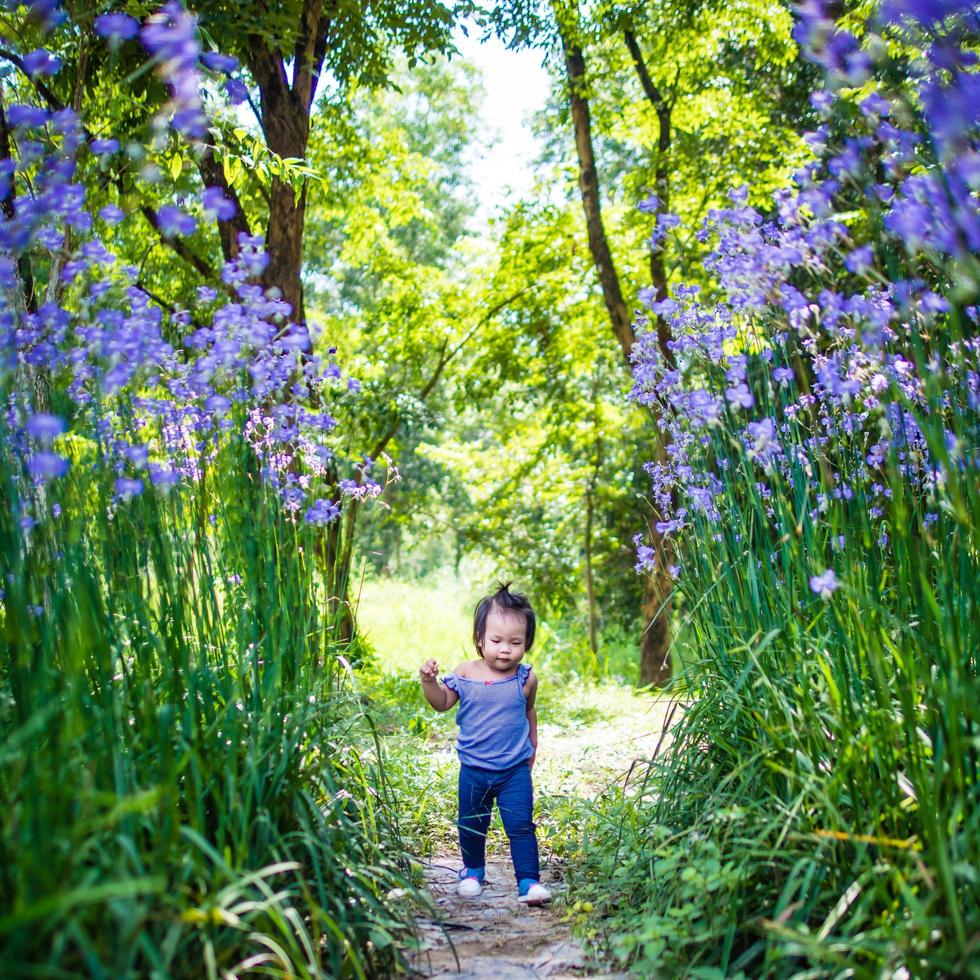 Girl running in a garden photo