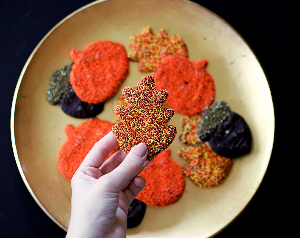 Top view of a person holding a halloween cookie photo