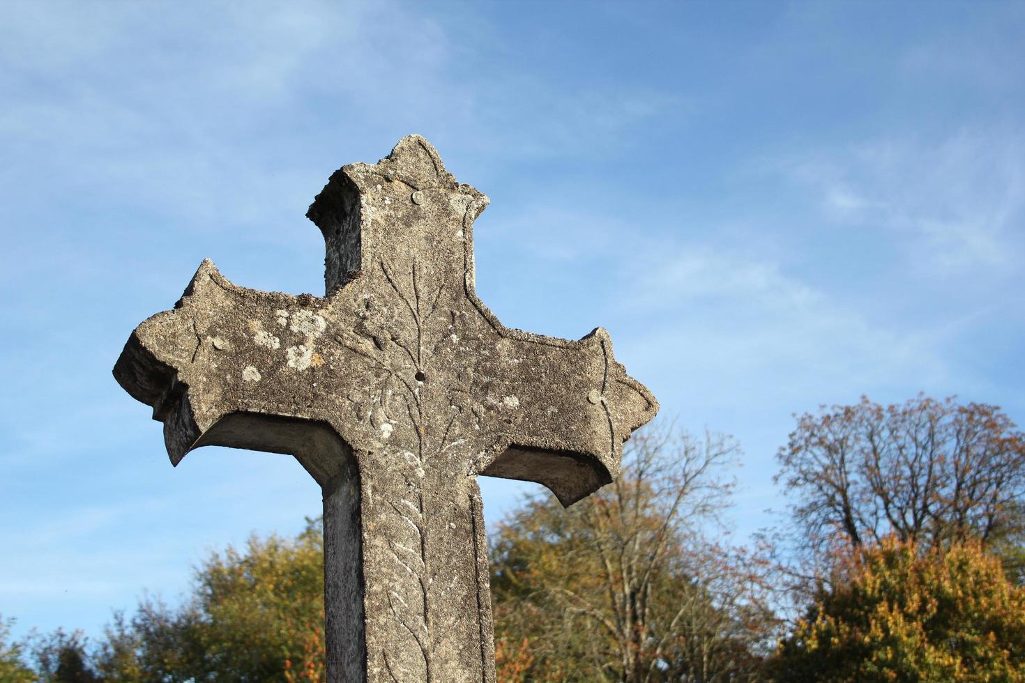 Religious cross against blue sky photo