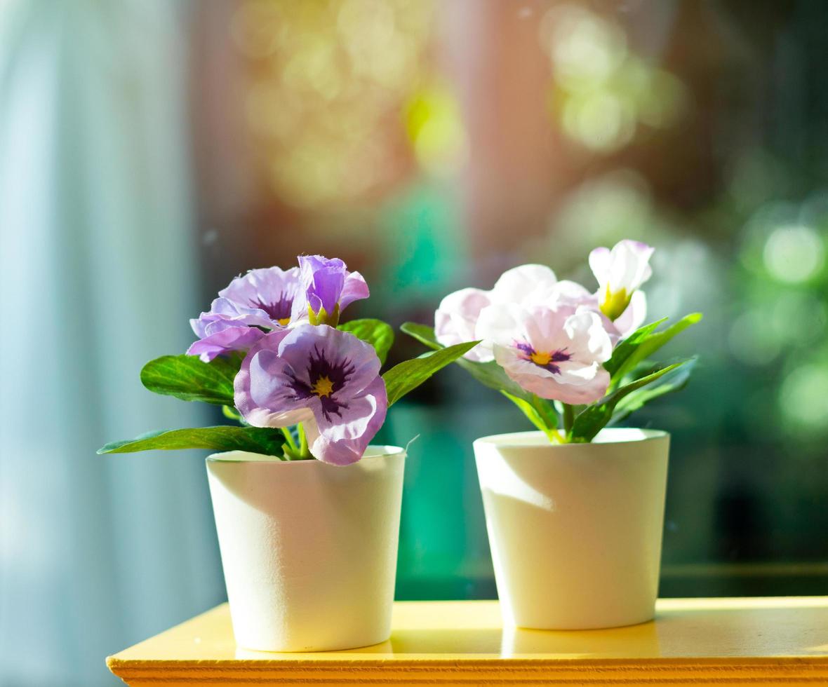 Artificial flowers in a vase photo