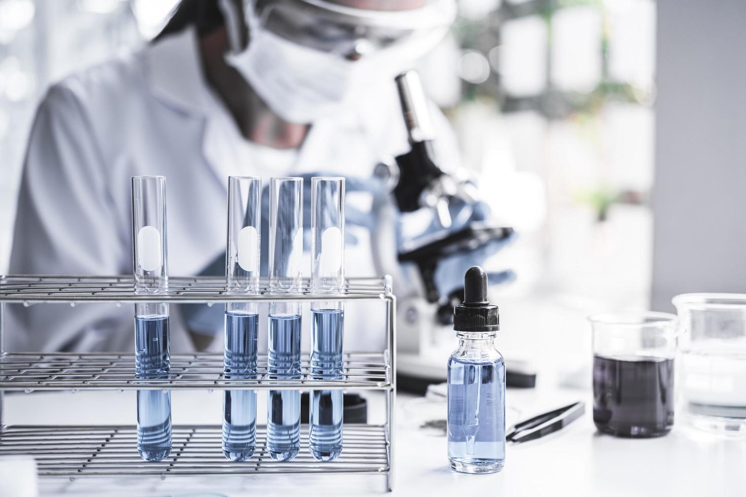  Chemist is analyzing sample in laboratory  photo