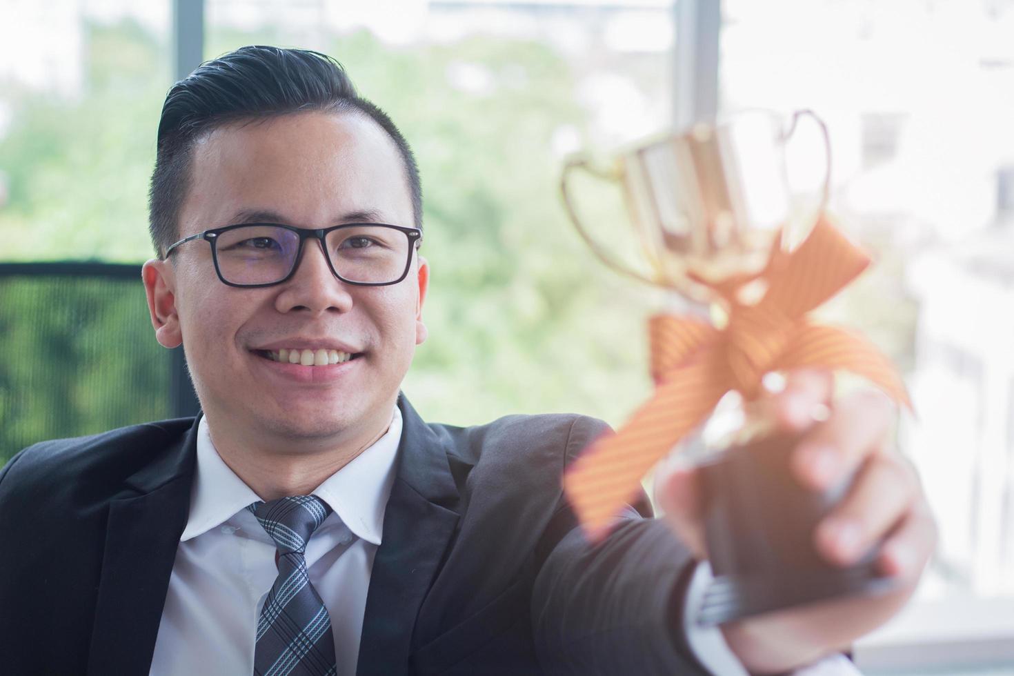 Businessman with a trophy photo