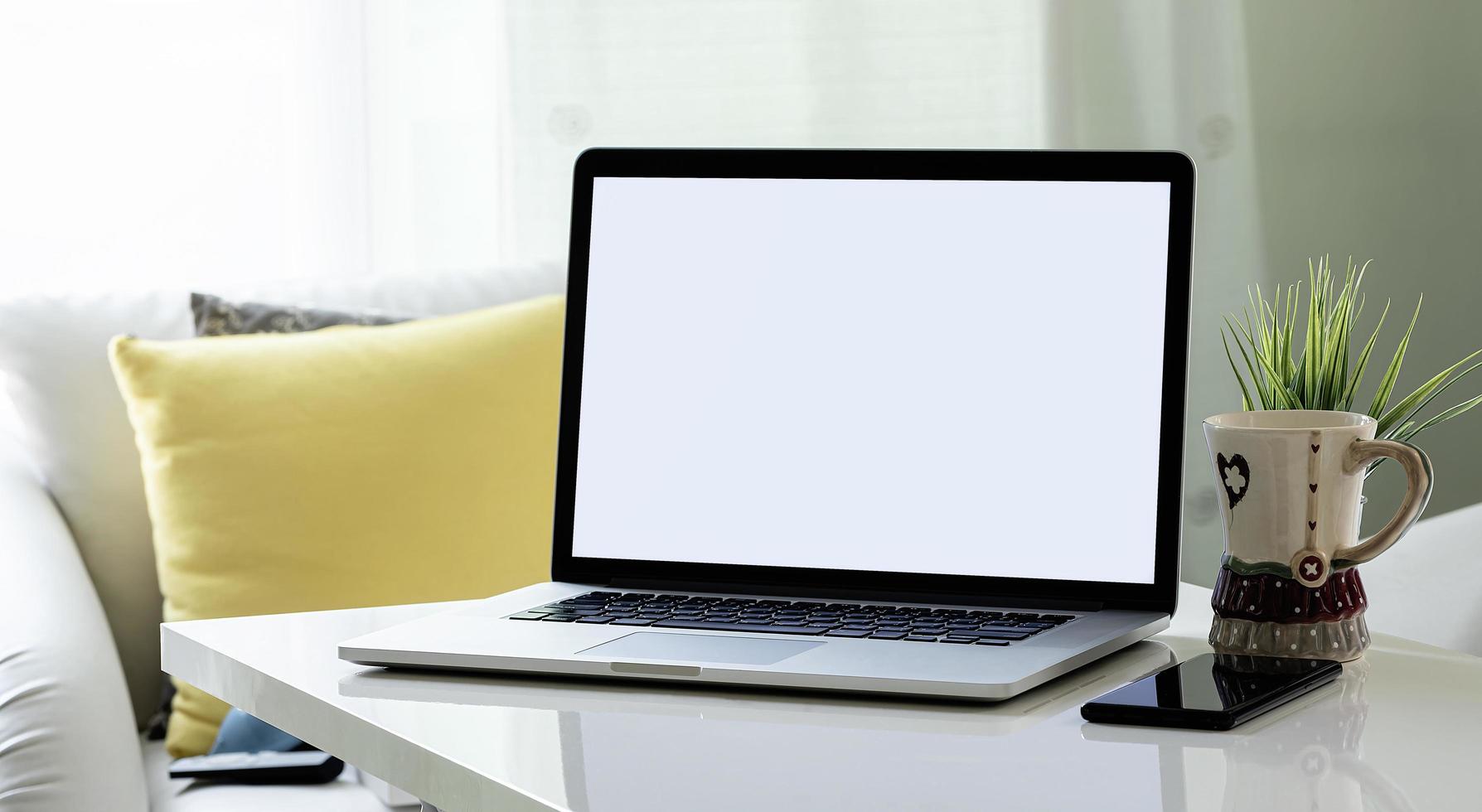 Laptop mockup in a living room photo