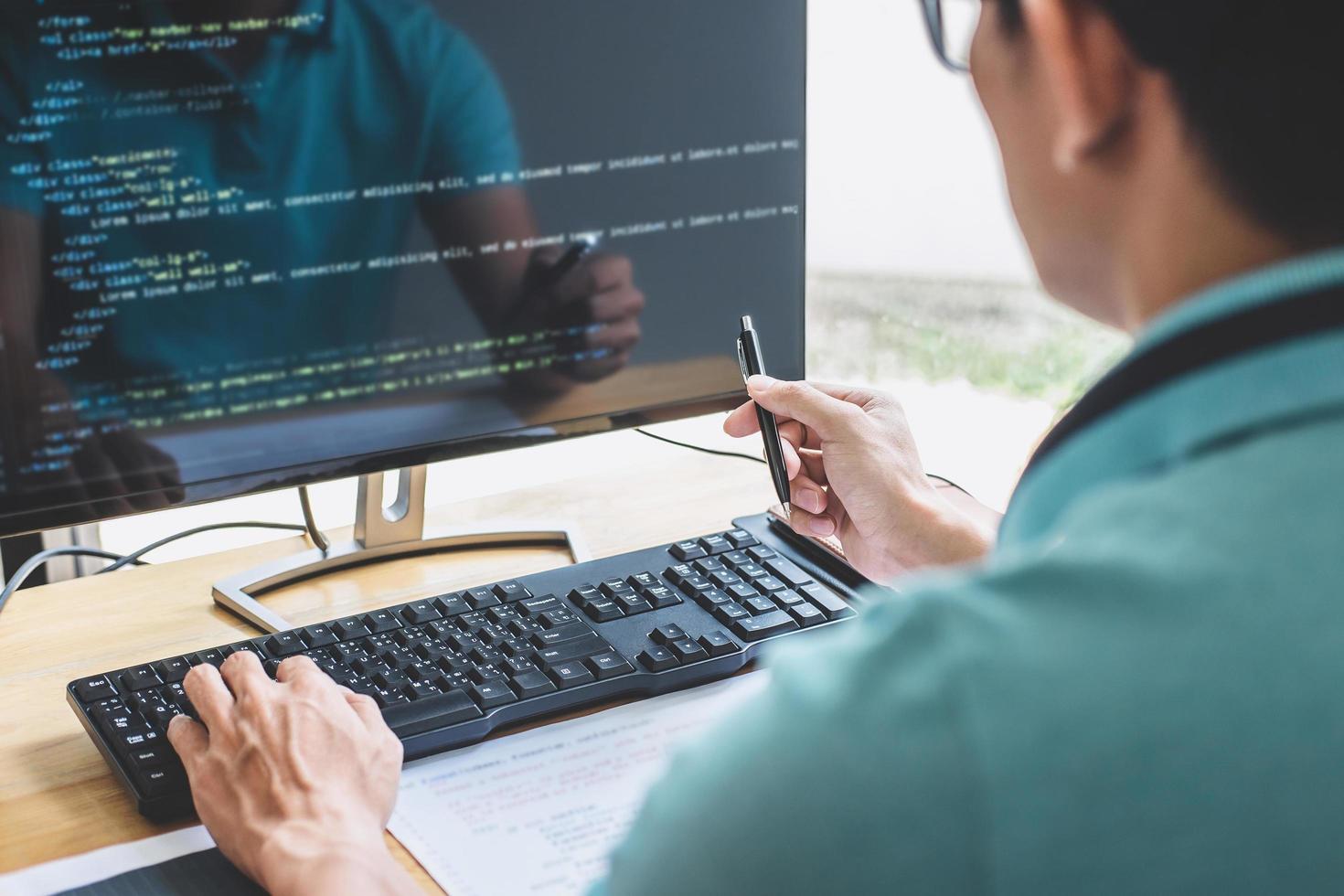 Young Professional programmer working at developing programming and website working in a software develop company office photo