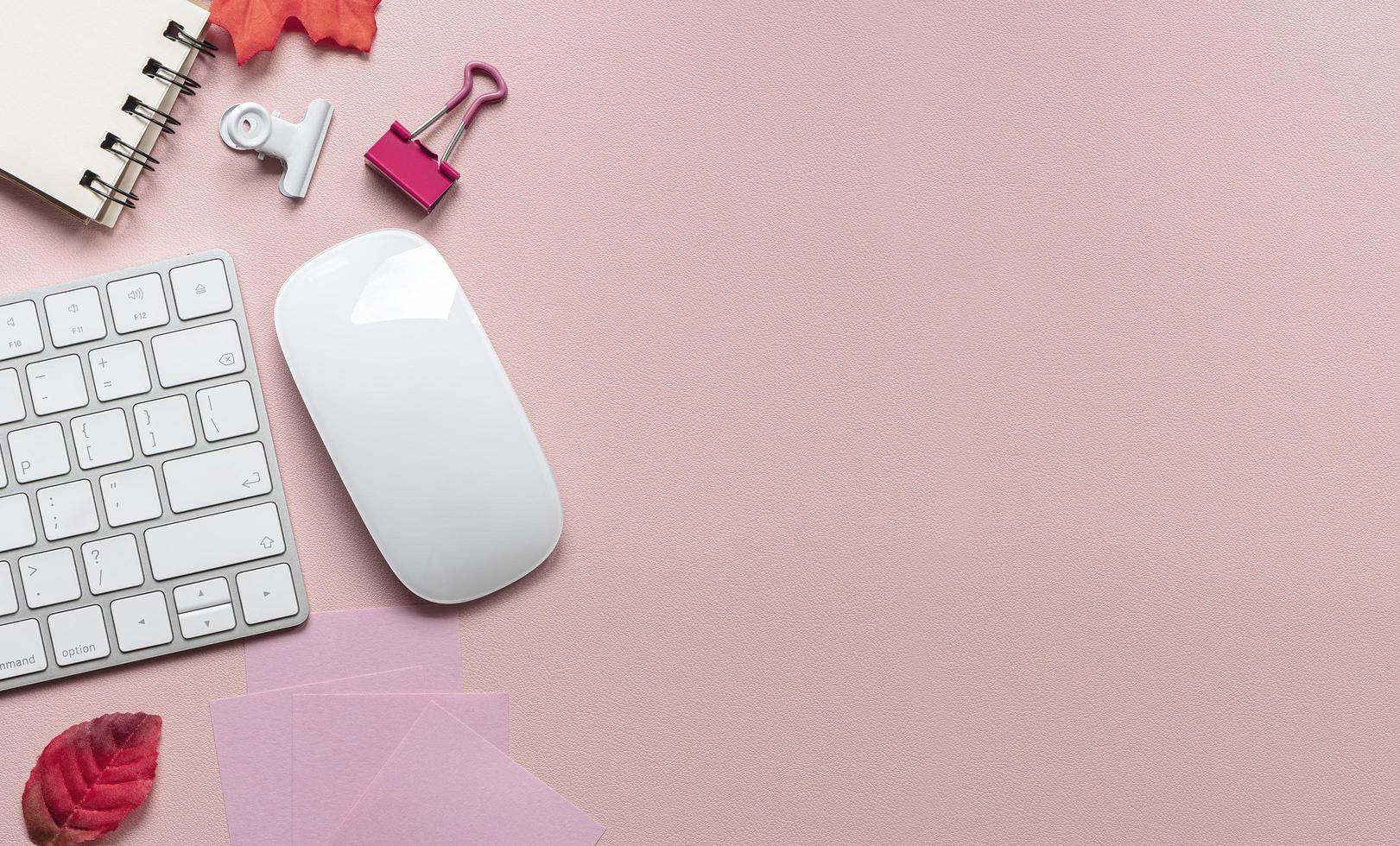 Top view of a workspace on a mauve desk photo