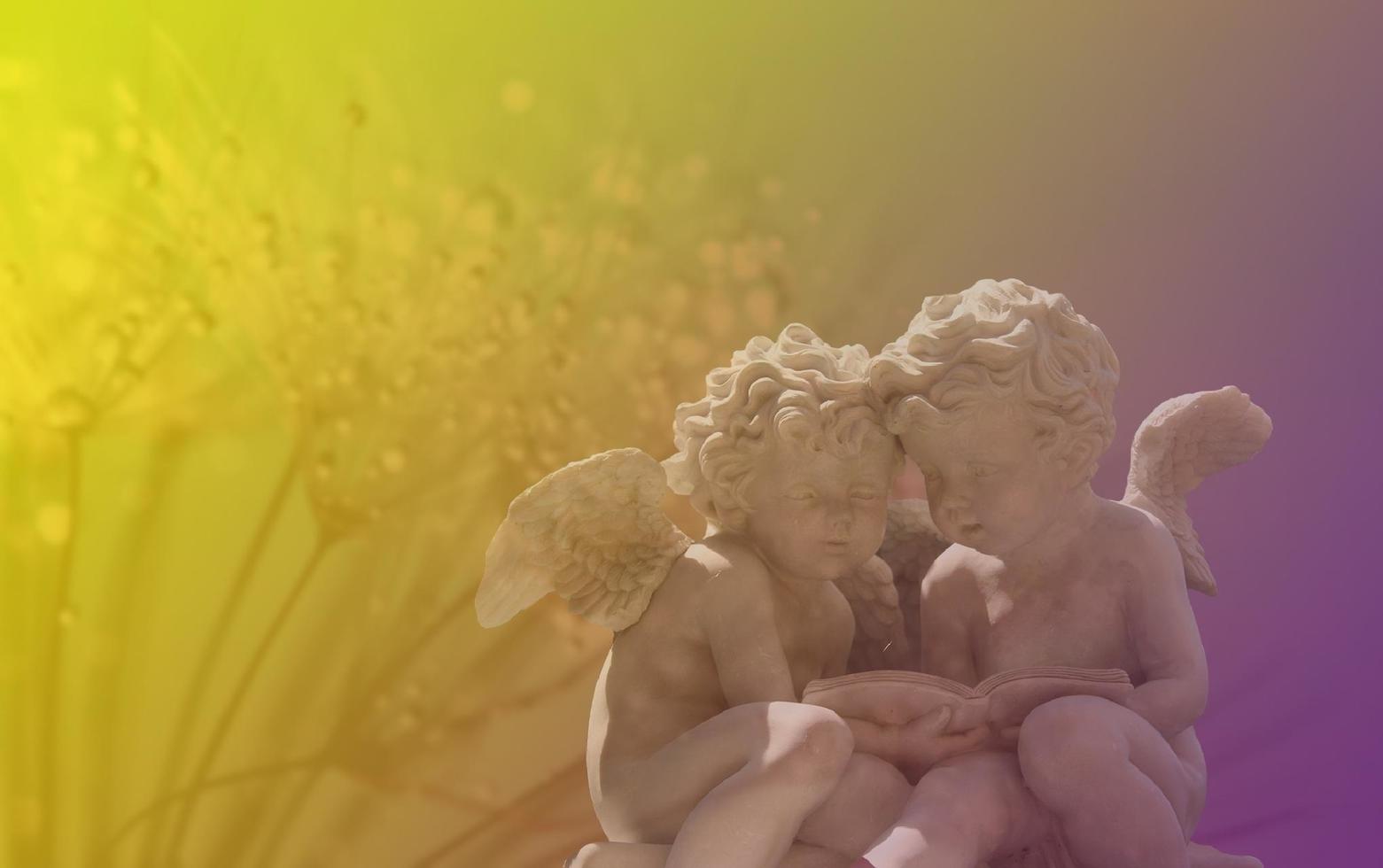 Angel statue in colorful light photo