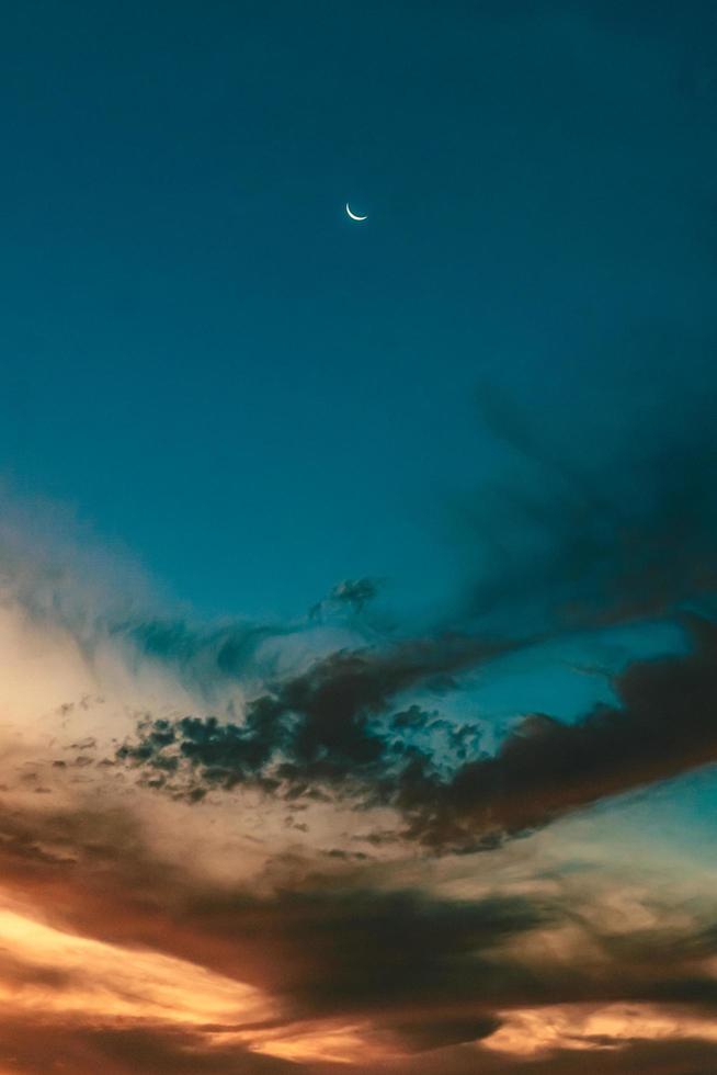 Moon and sunset photo