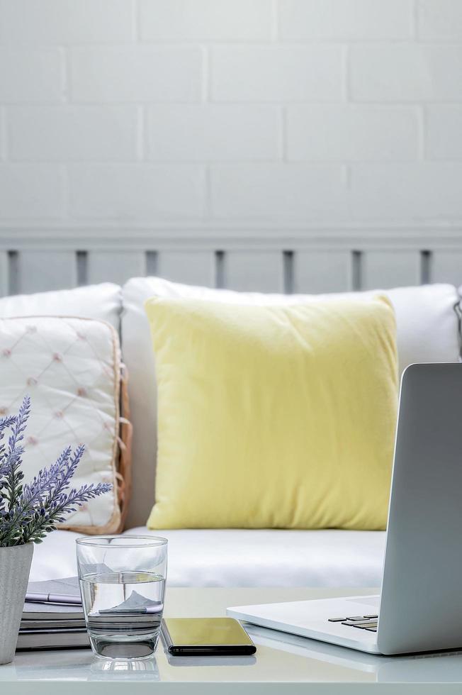 Laptop on a coffee table in a living room photo