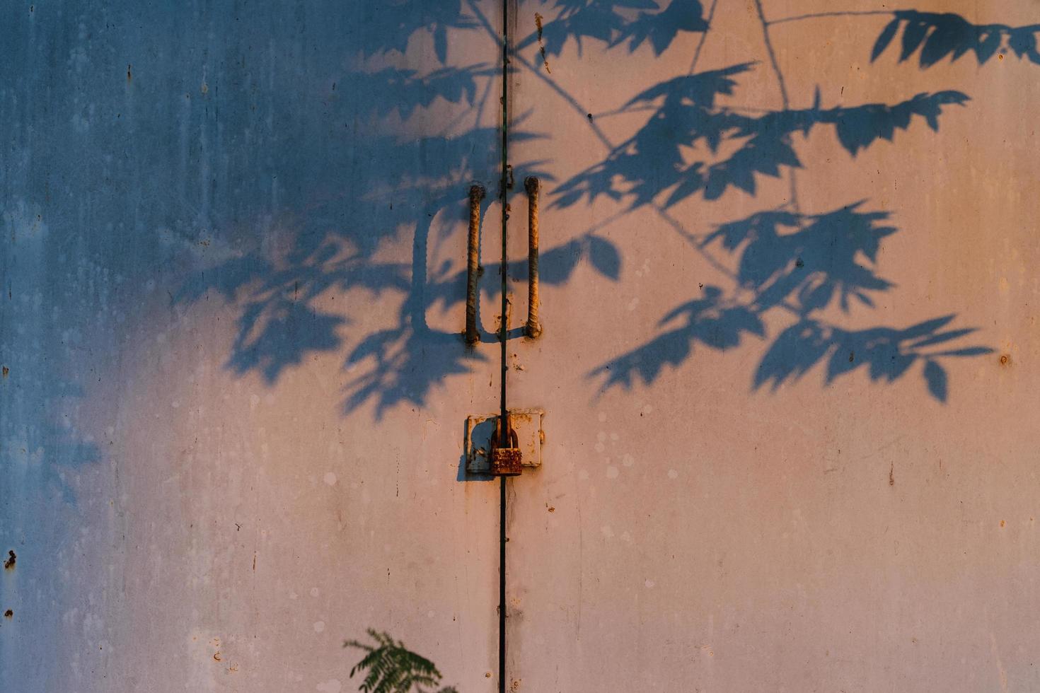 Rusty padlock and shadow photo