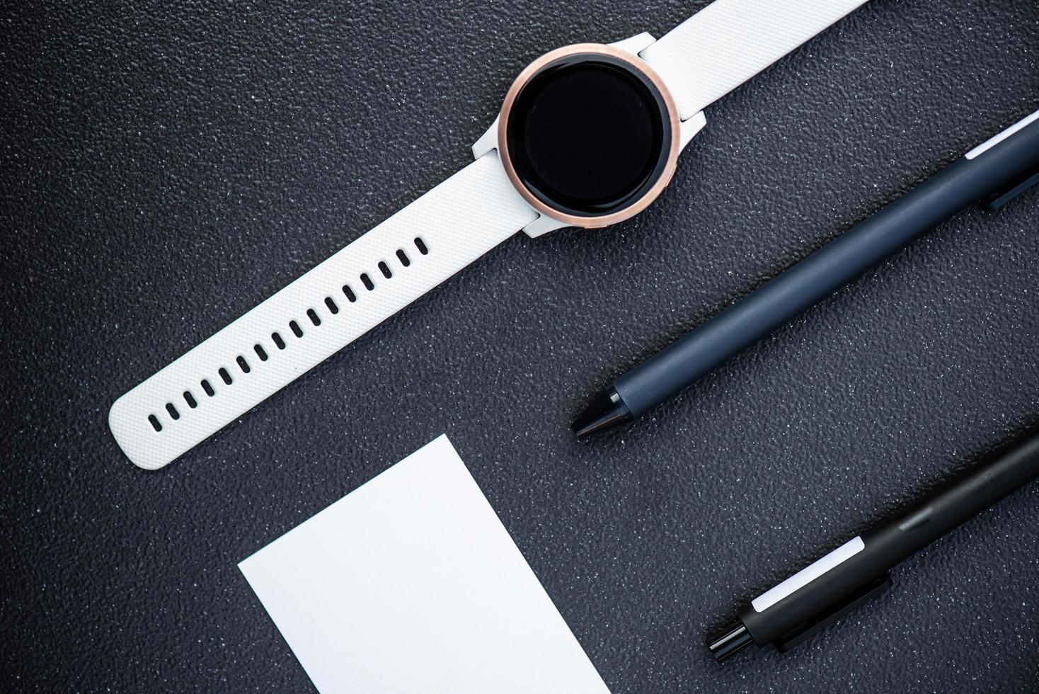 Smart watch and pens photo