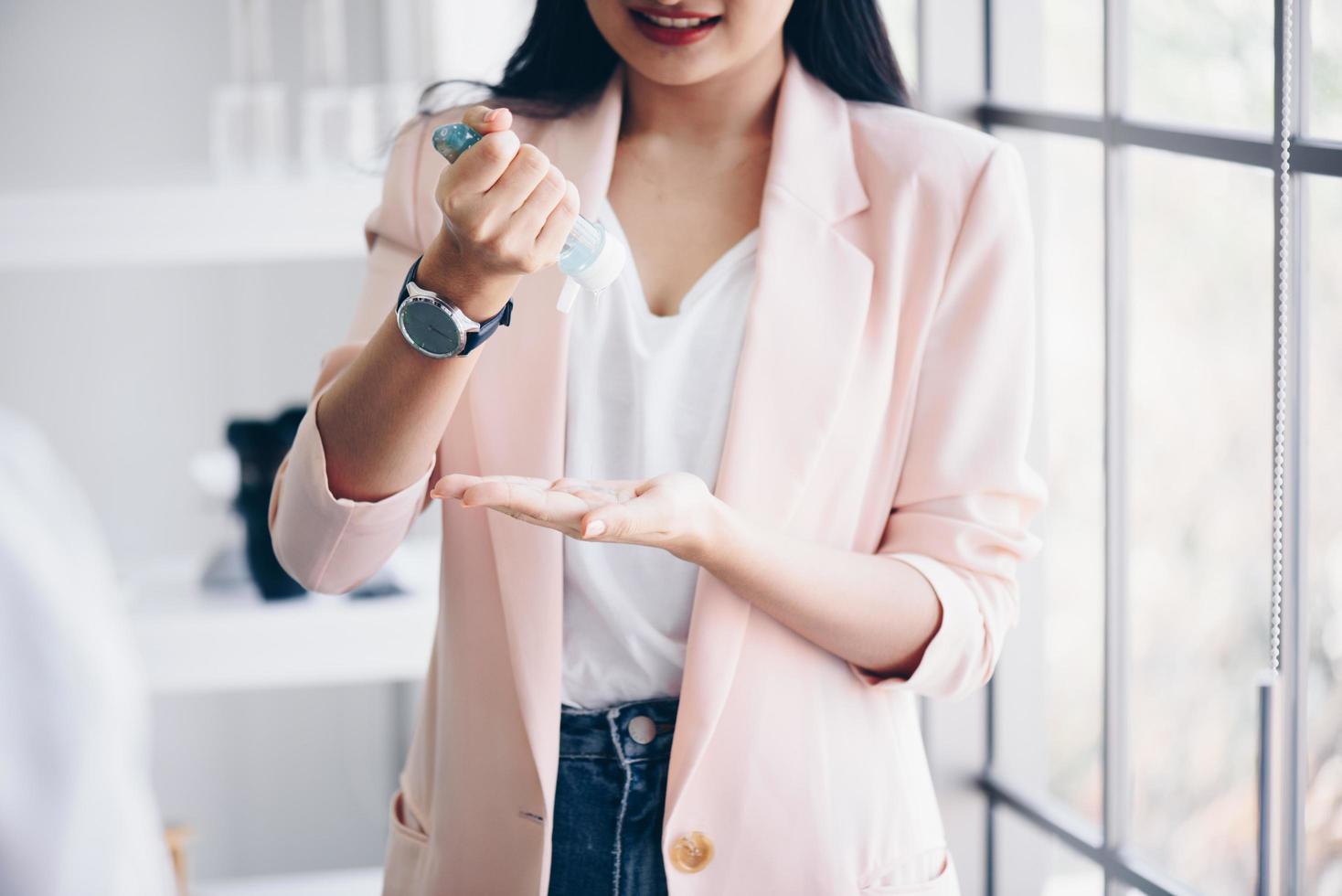 Person using hand sanitizer photo