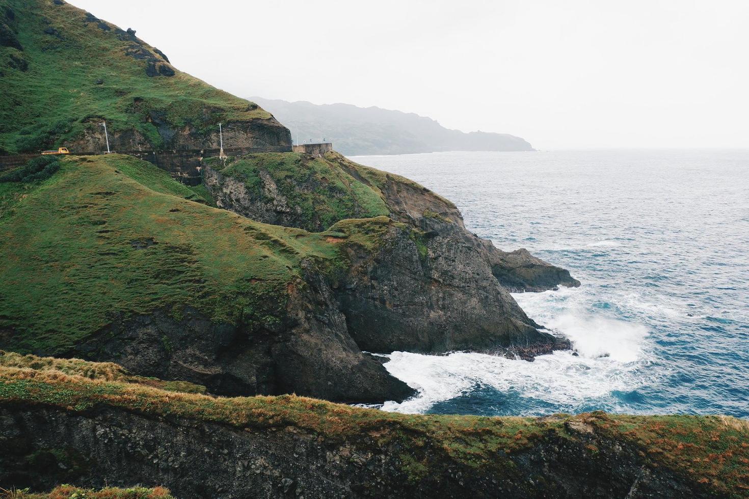 A road and hills by the ocean photo