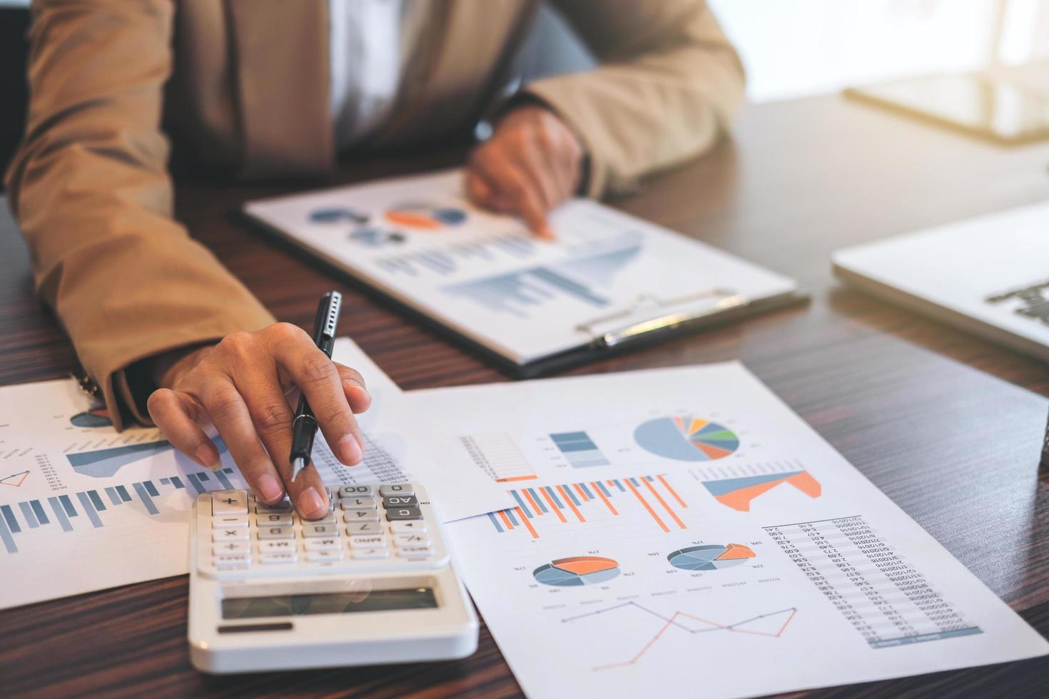 Close-up of a businessman checking numbers photo