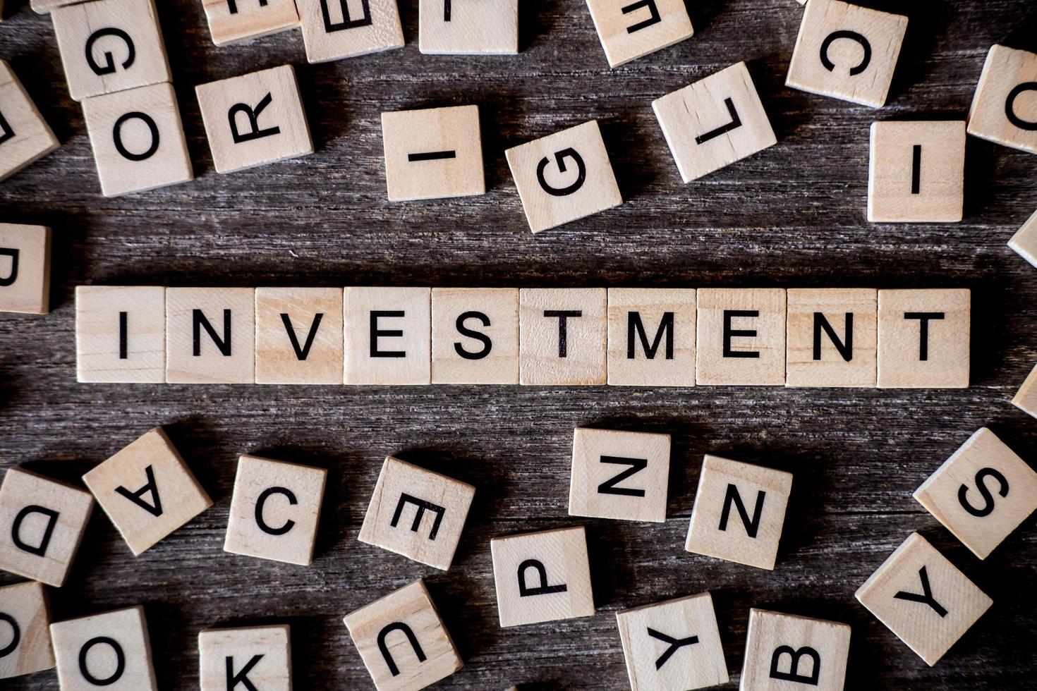 Close-up of wooden letters spelling out the word investment photo