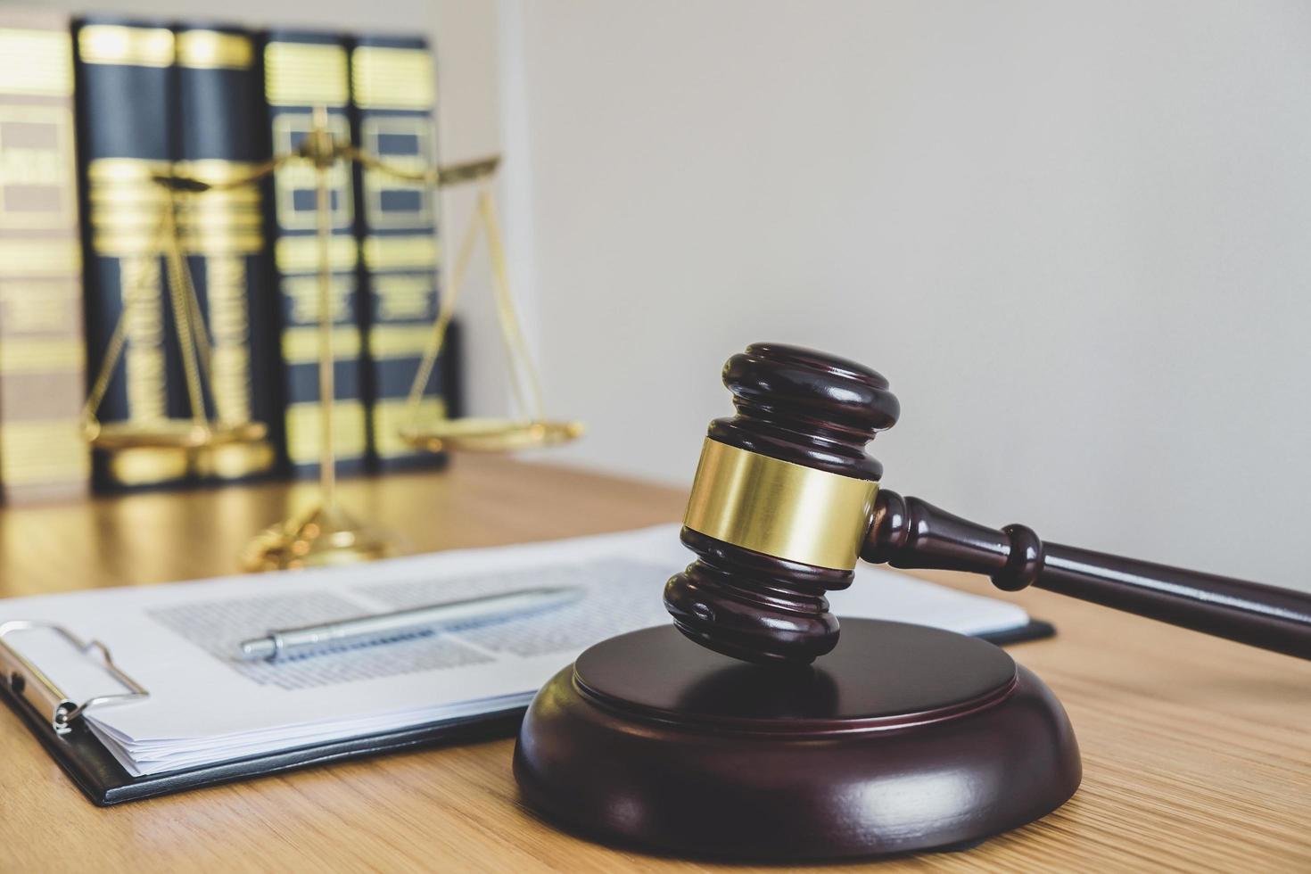 Close-up of a gavel and law books photo