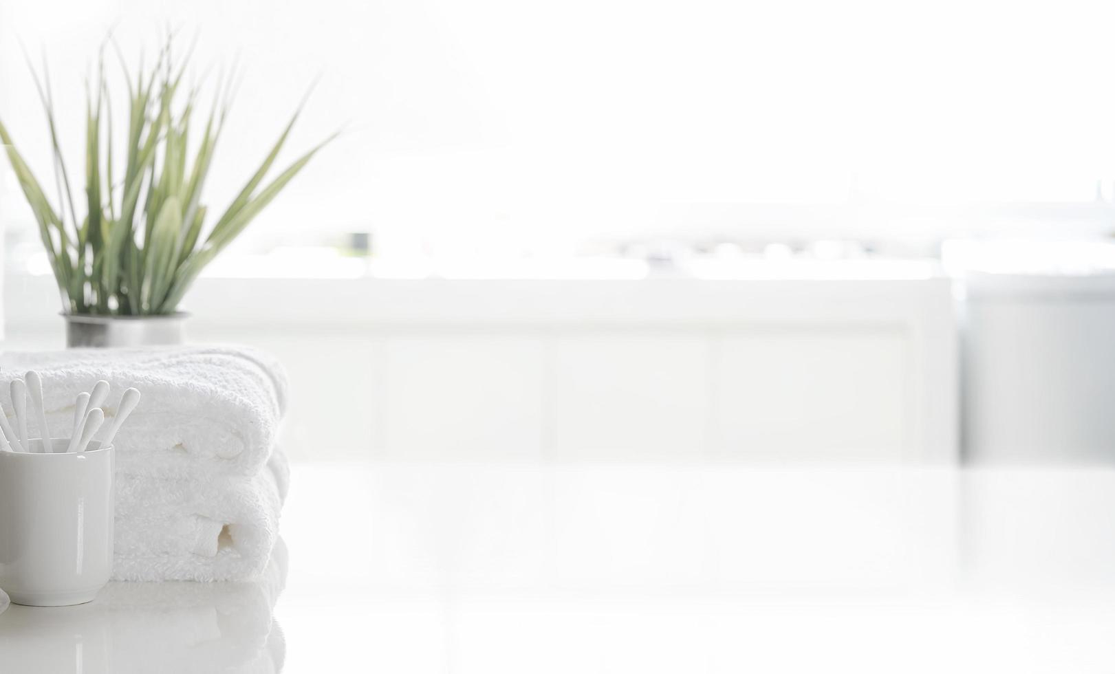 Plant and towels on a table photo