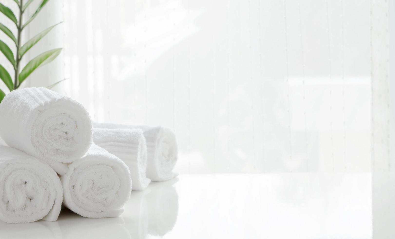 Stack of rolled towels on a table photo