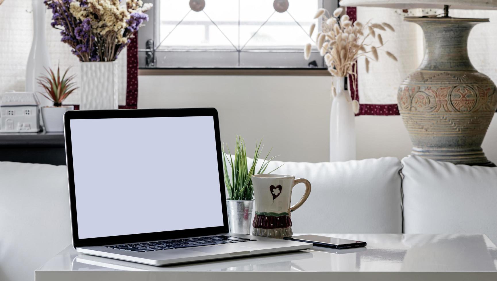 Laptop mockup in a living room photo