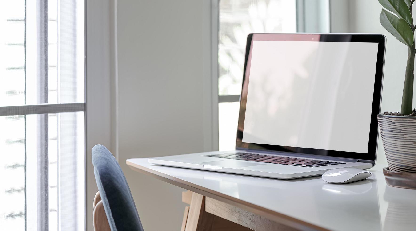 Laptop mockup in an office photo