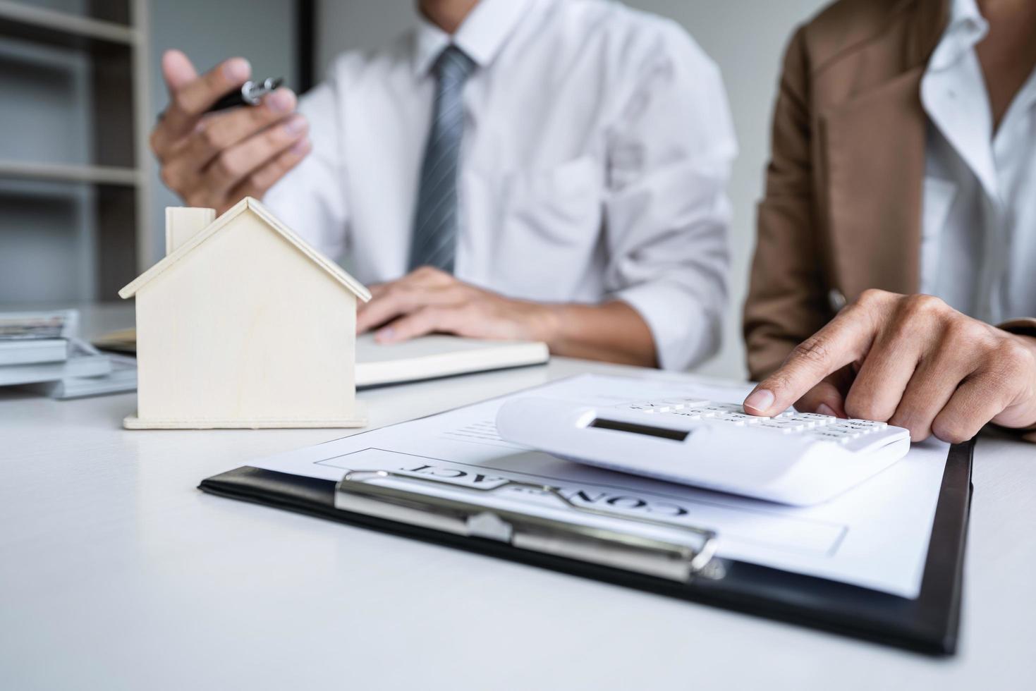 Two people calculating housing costs photo